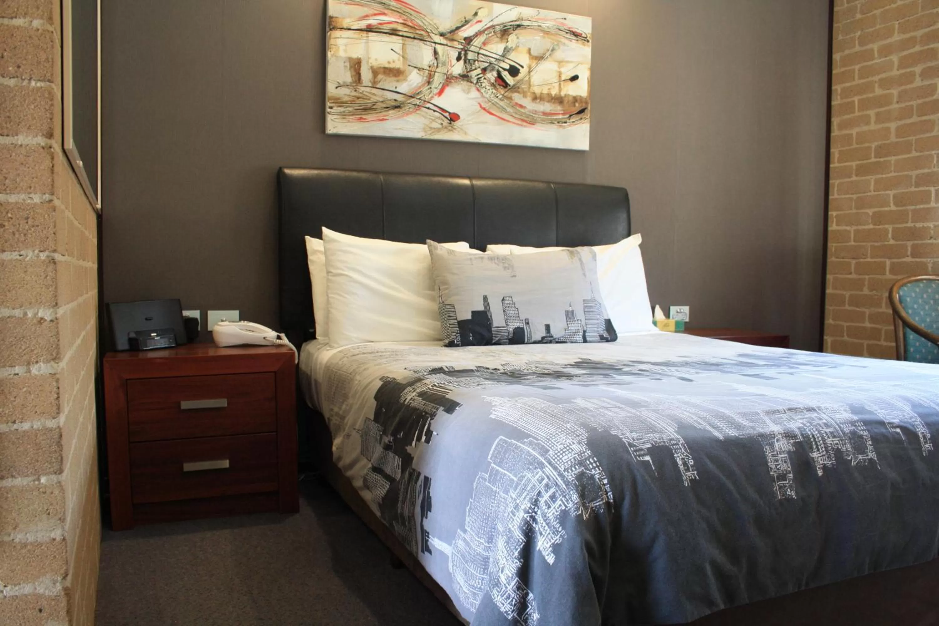 Bed in Grand Manor Motor Inn