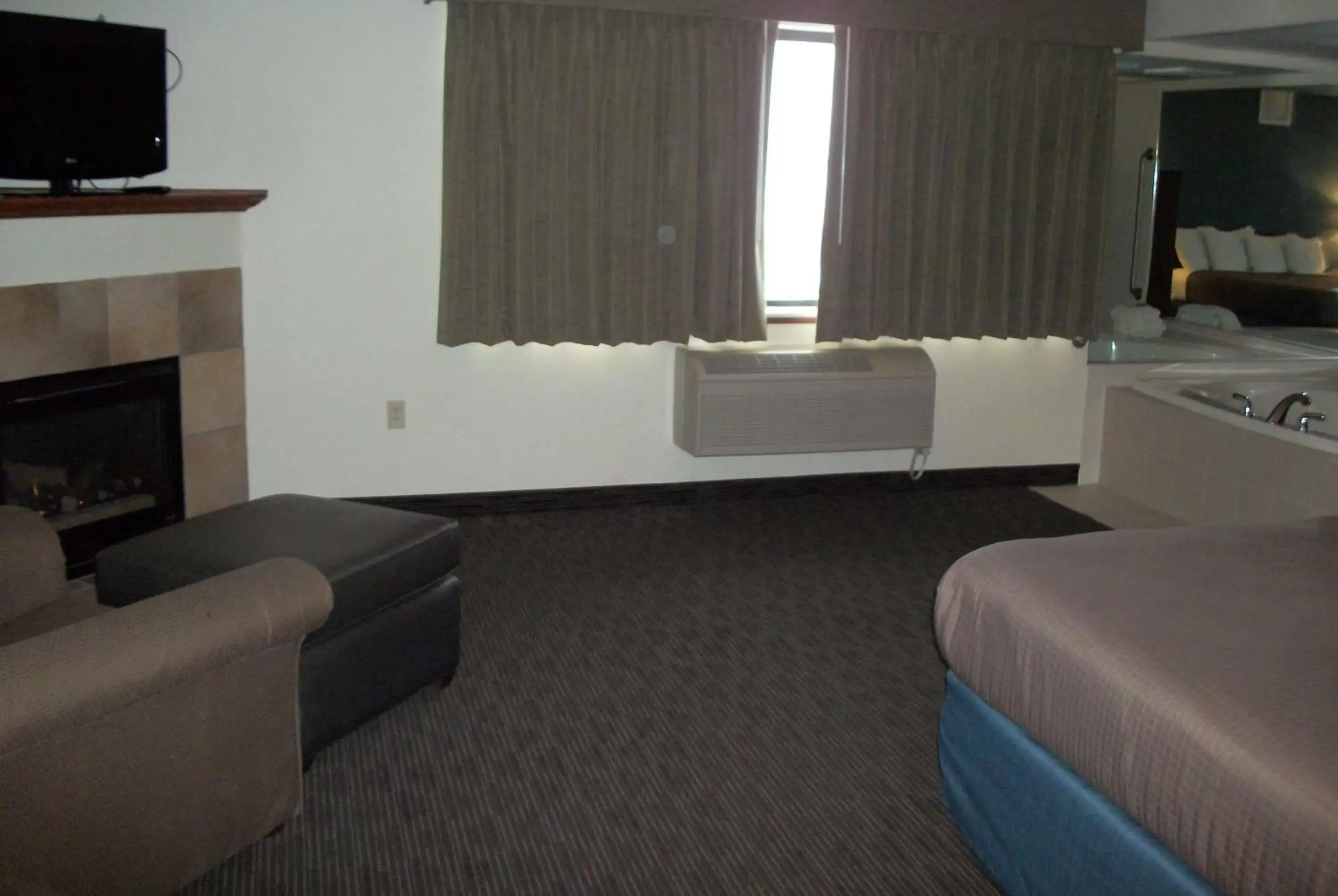 Photo of the whole room, Seating Area in AmericInn by Wyndham Beulah