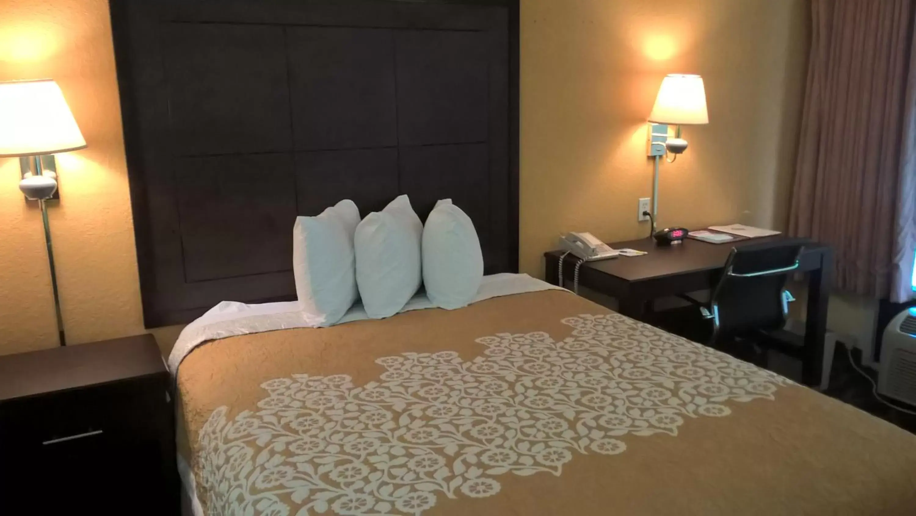 Decorative detail, Bed in Days Inn & Suites by Wyndham Port Richey