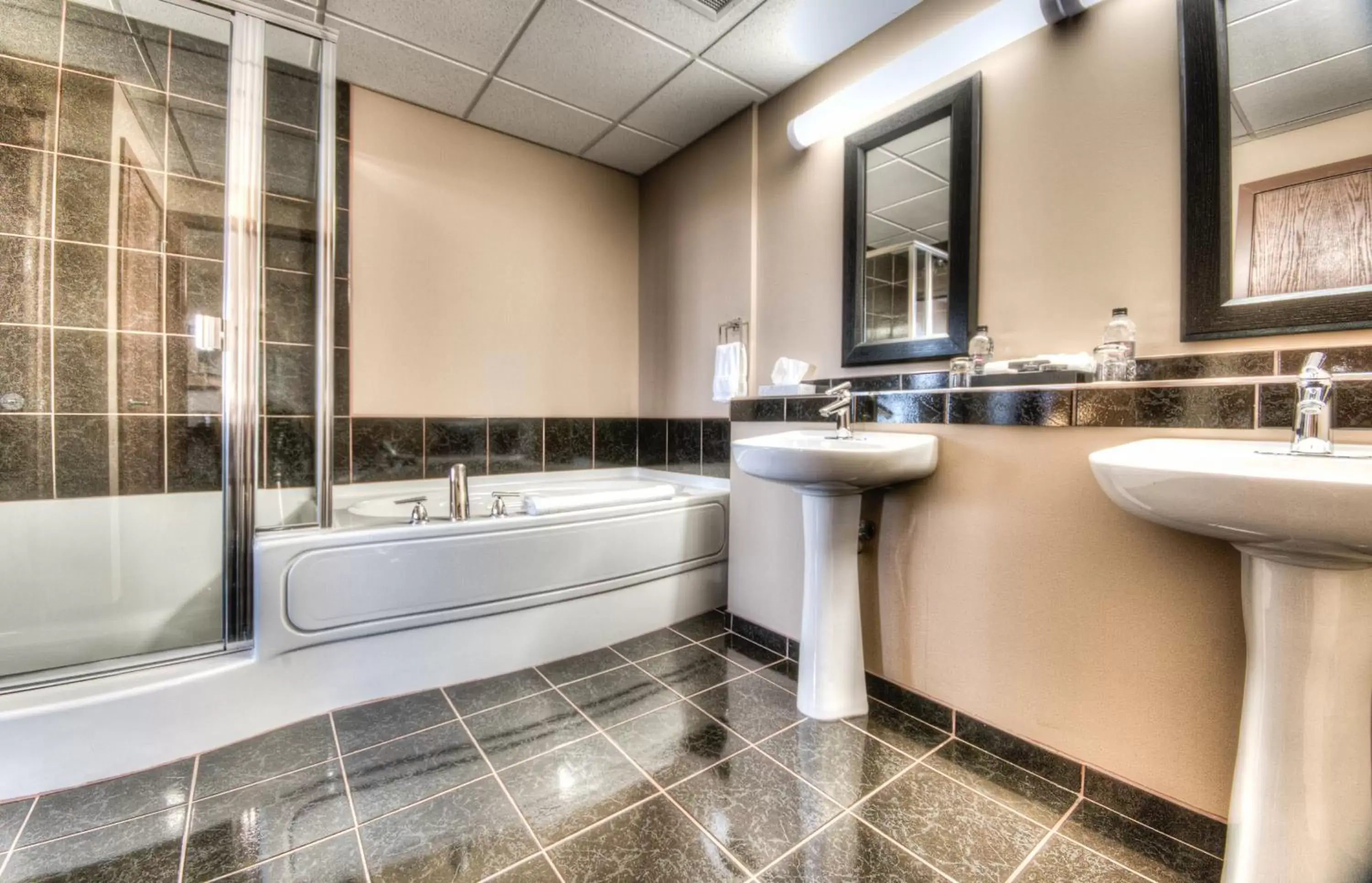 Bathroom in Grand Inn & Residence- Grande Prairie