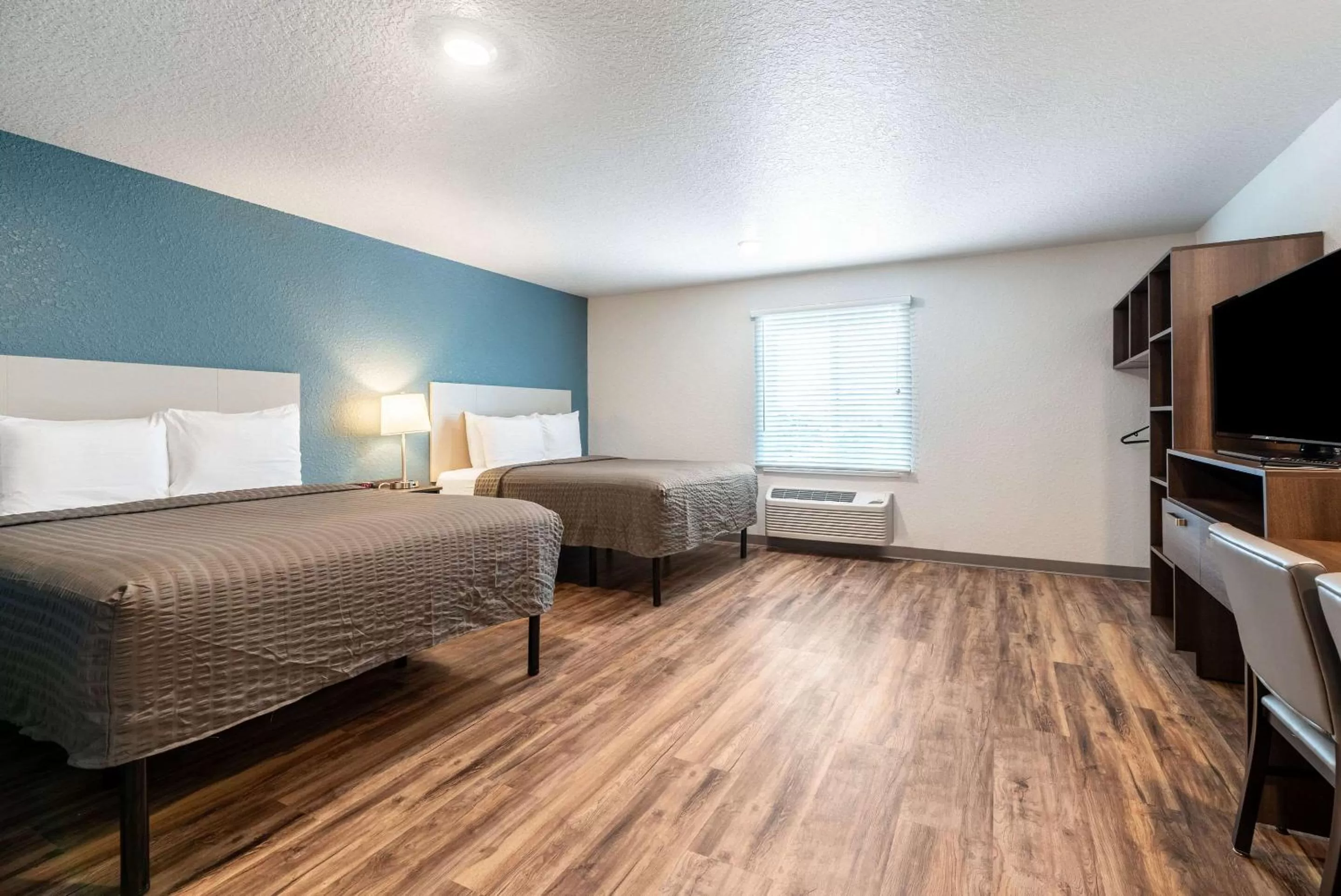 Photo of the whole room, Bed in WoodSpring Suites Sanford North I-4 Orlando Area