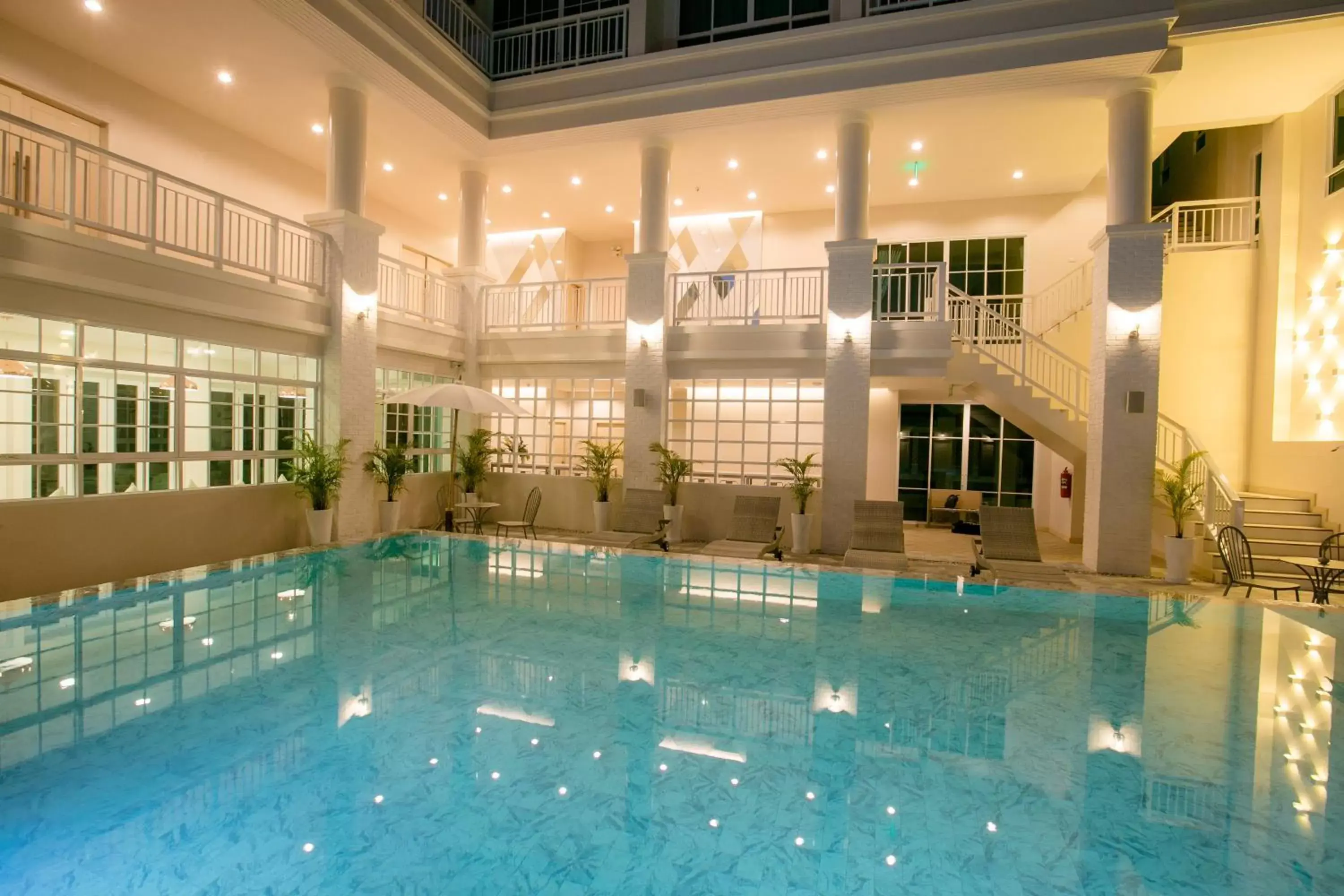 Pool view in De Hug Hotel & Residence Pool view in De Hug Hotel & Residence