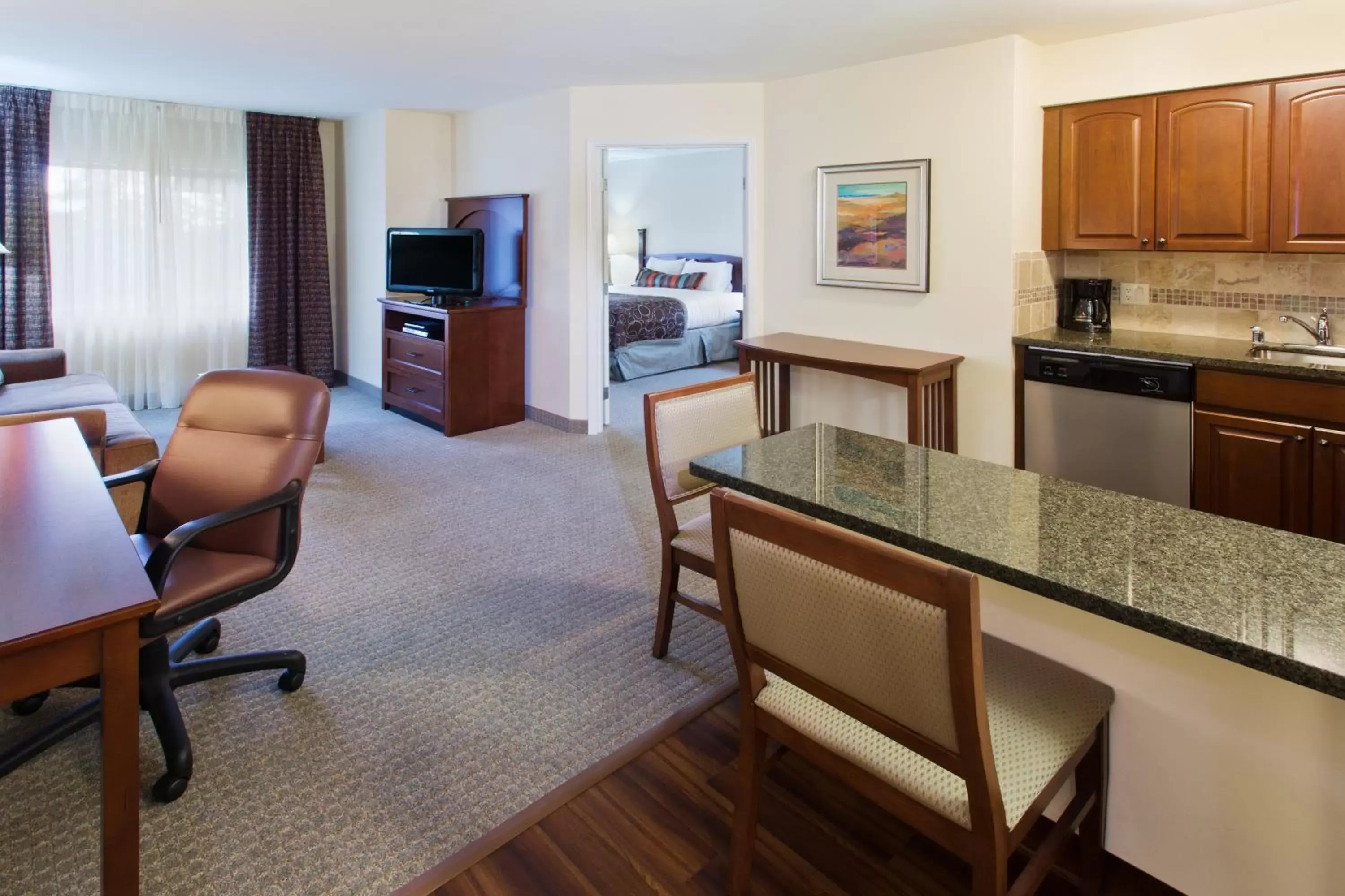 Bedroom, Kitchen/Kitchenette in Staybridge Suites Everett - Paine Field, an IHG Hotel