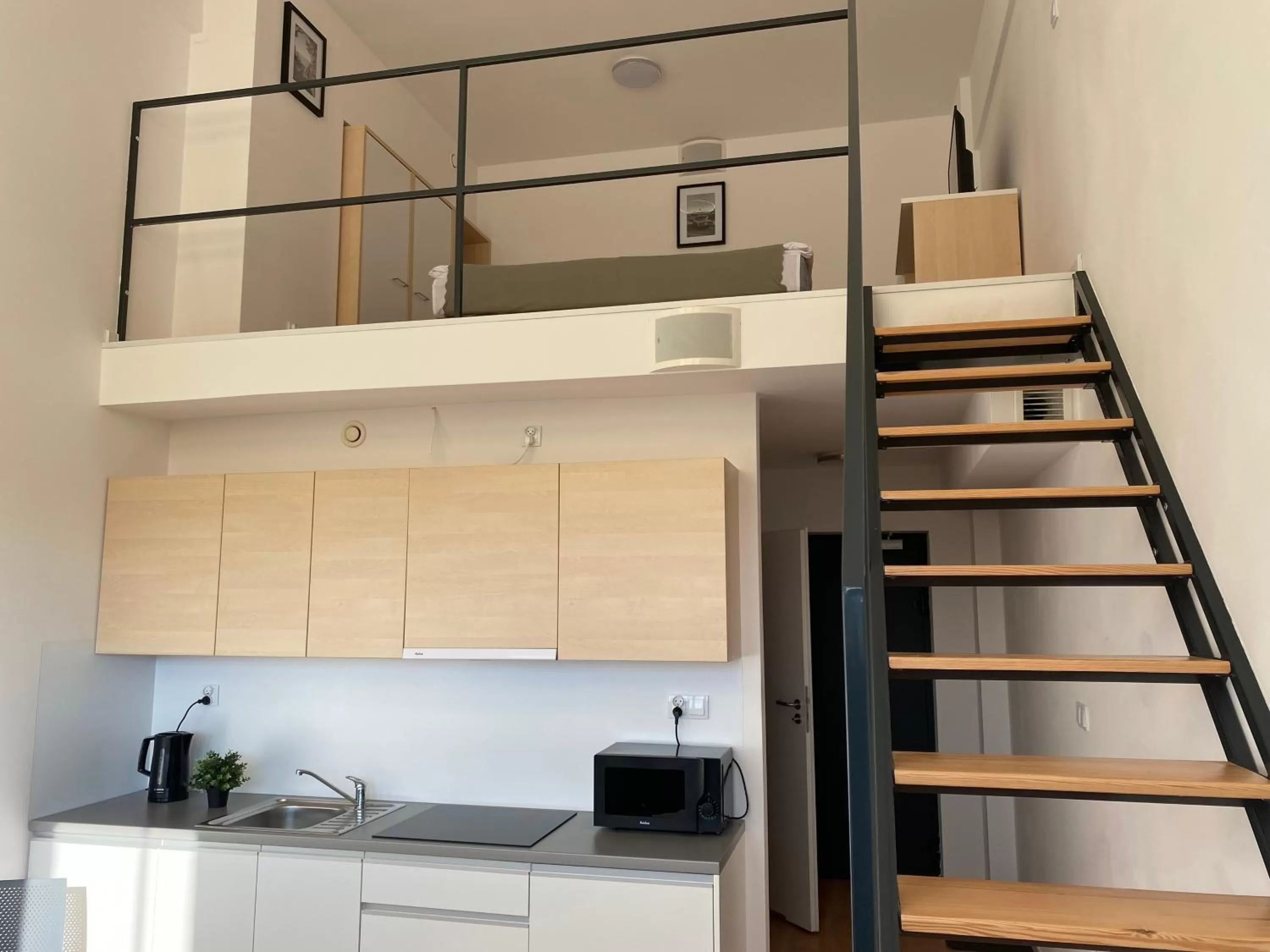 Bedroom in SleepWell Apartments