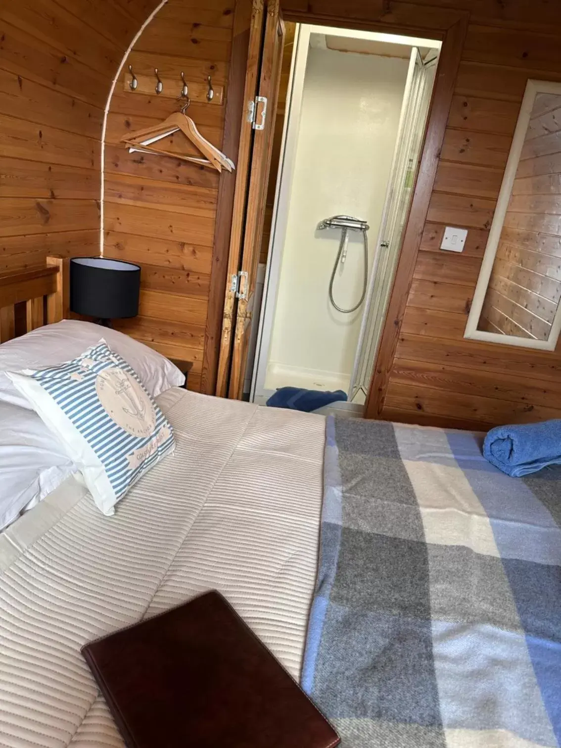 Bed in Sea and Mountain View Luxury Glamping Pods Heated