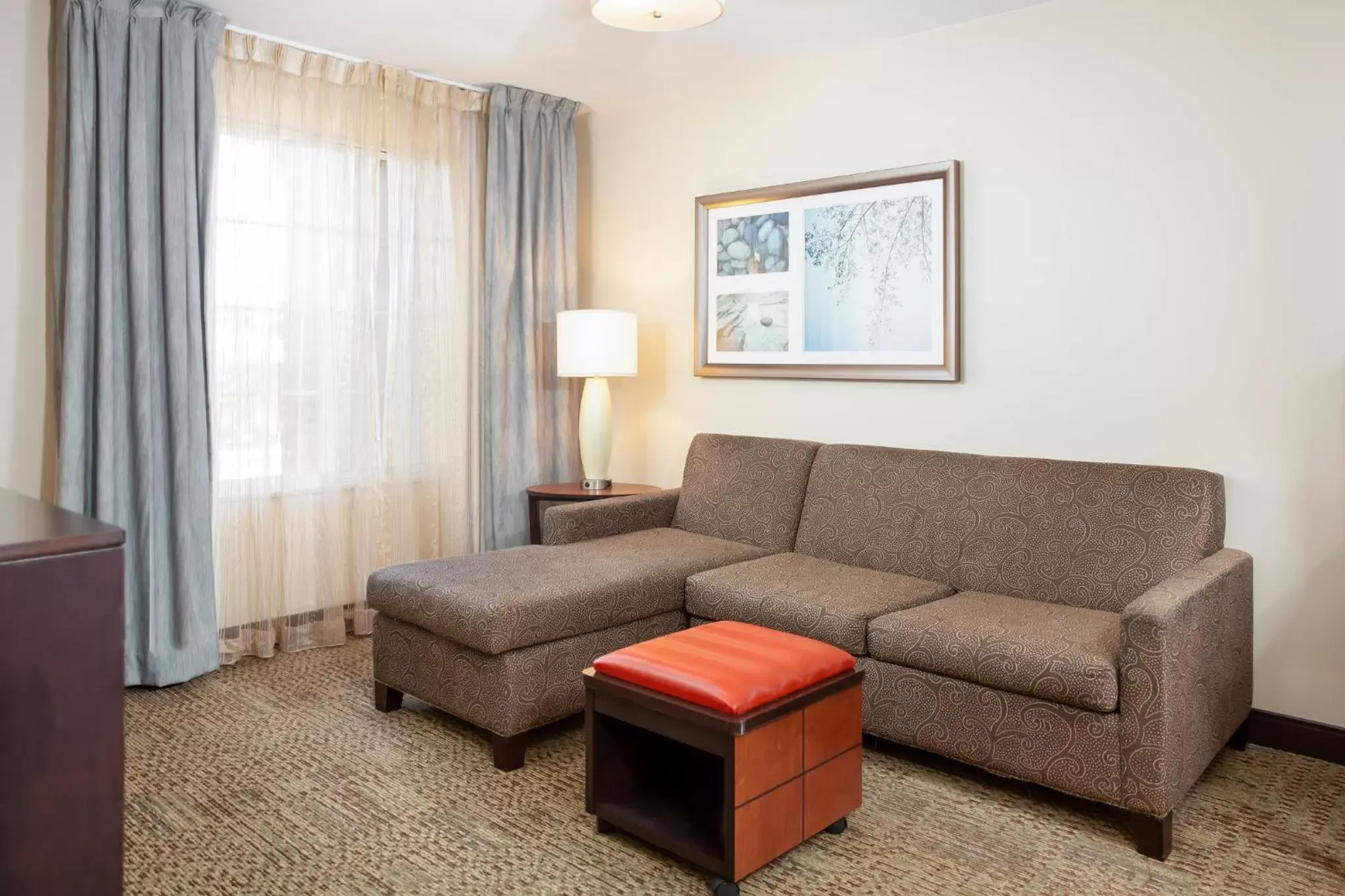 Photo of the whole room, Seating Area in Staybridge Suites Denver - Central Park, an IHG Hotel