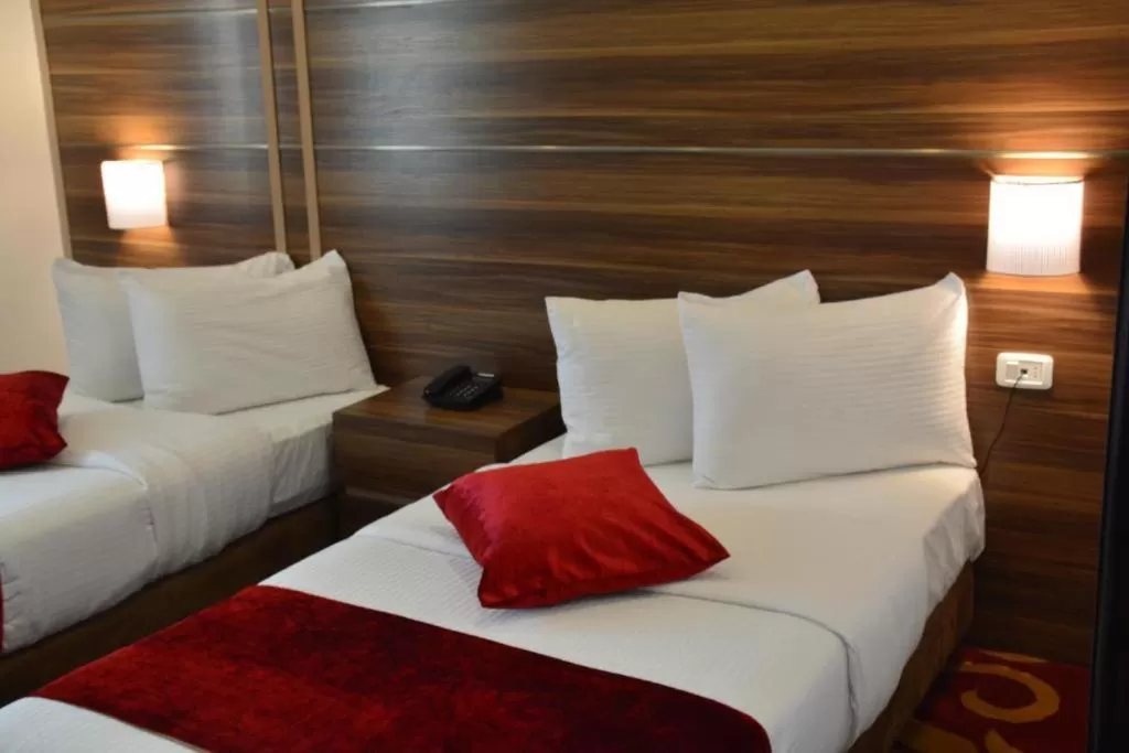 Bed in Spark Plaza Hotel