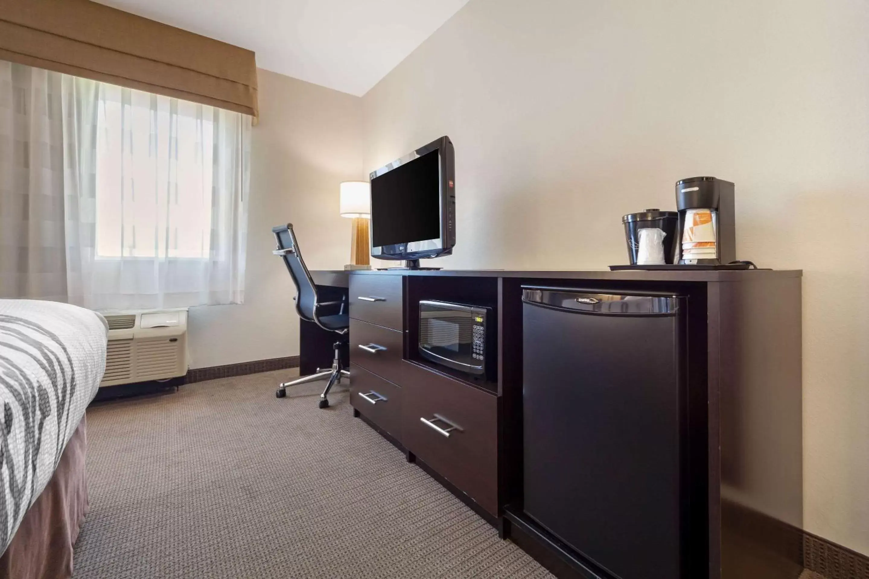 Photo of the whole room, TV/Entertainment Center in Sleep Inn & Suites Bismarck I-94
