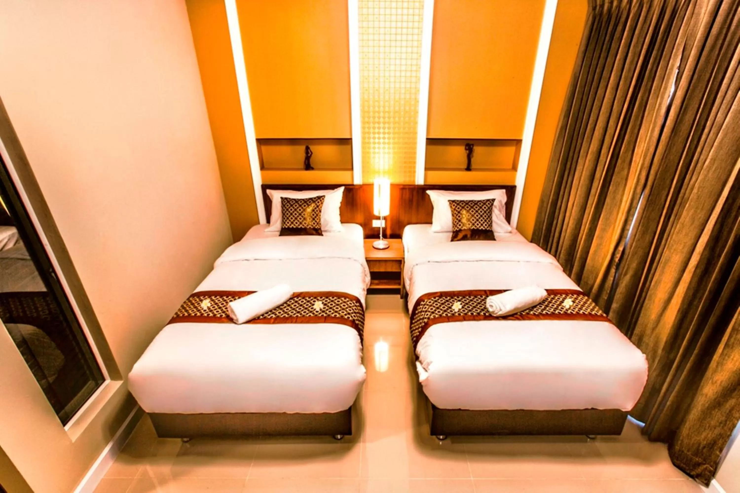 Photo of the whole room, Bed in The Aim Sathorn Hotel