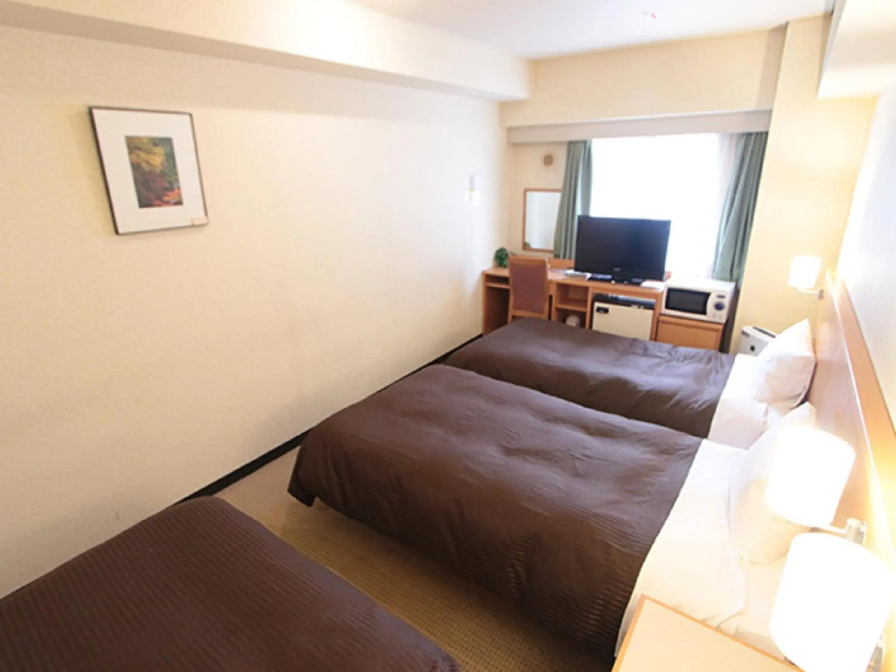 Bed in HOTEL LiVEMAX BUDGET Yokohama Kannai