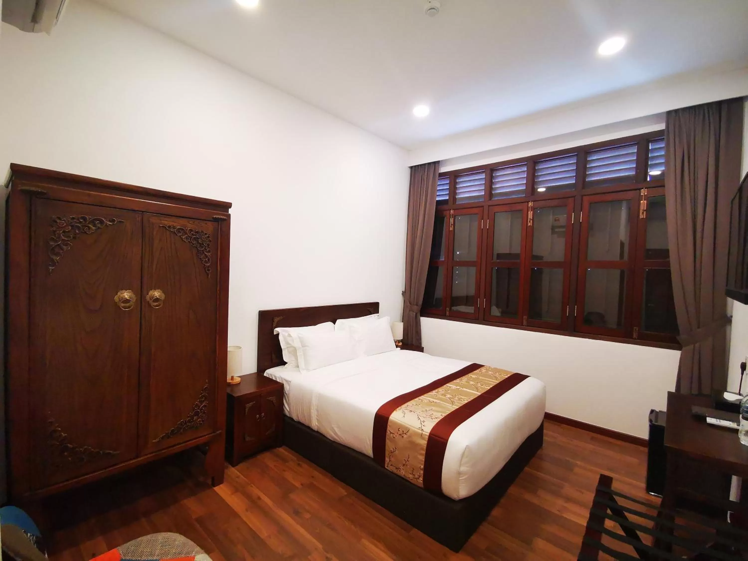 Bed in Mclane Boutique Hotel