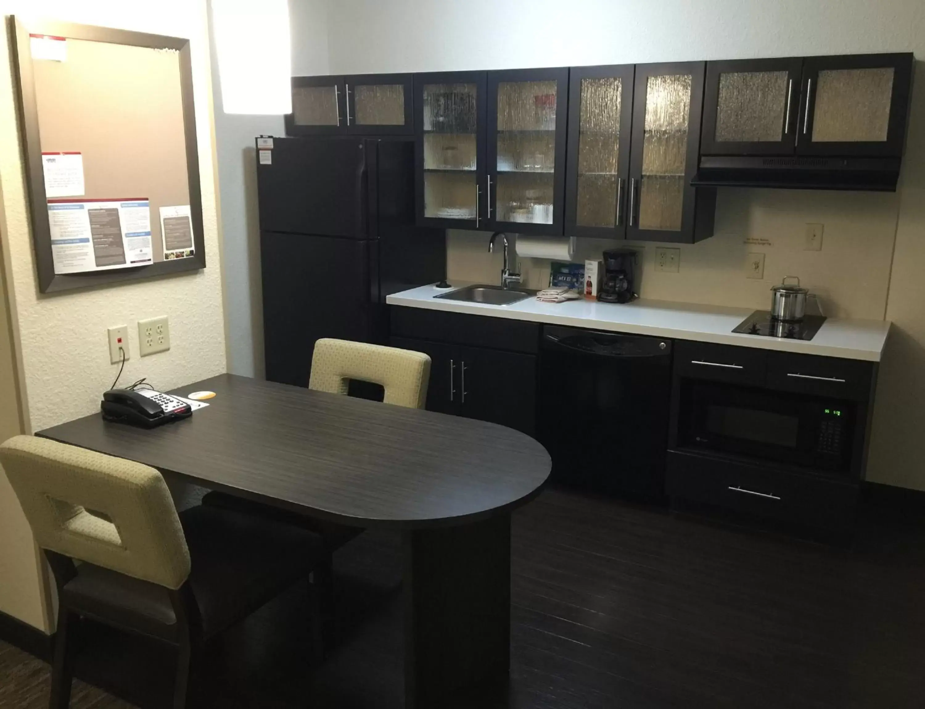 Photo of the whole room, Kitchen/Kitchenette in Candlewood Suites Woodward, an IHG Hotel