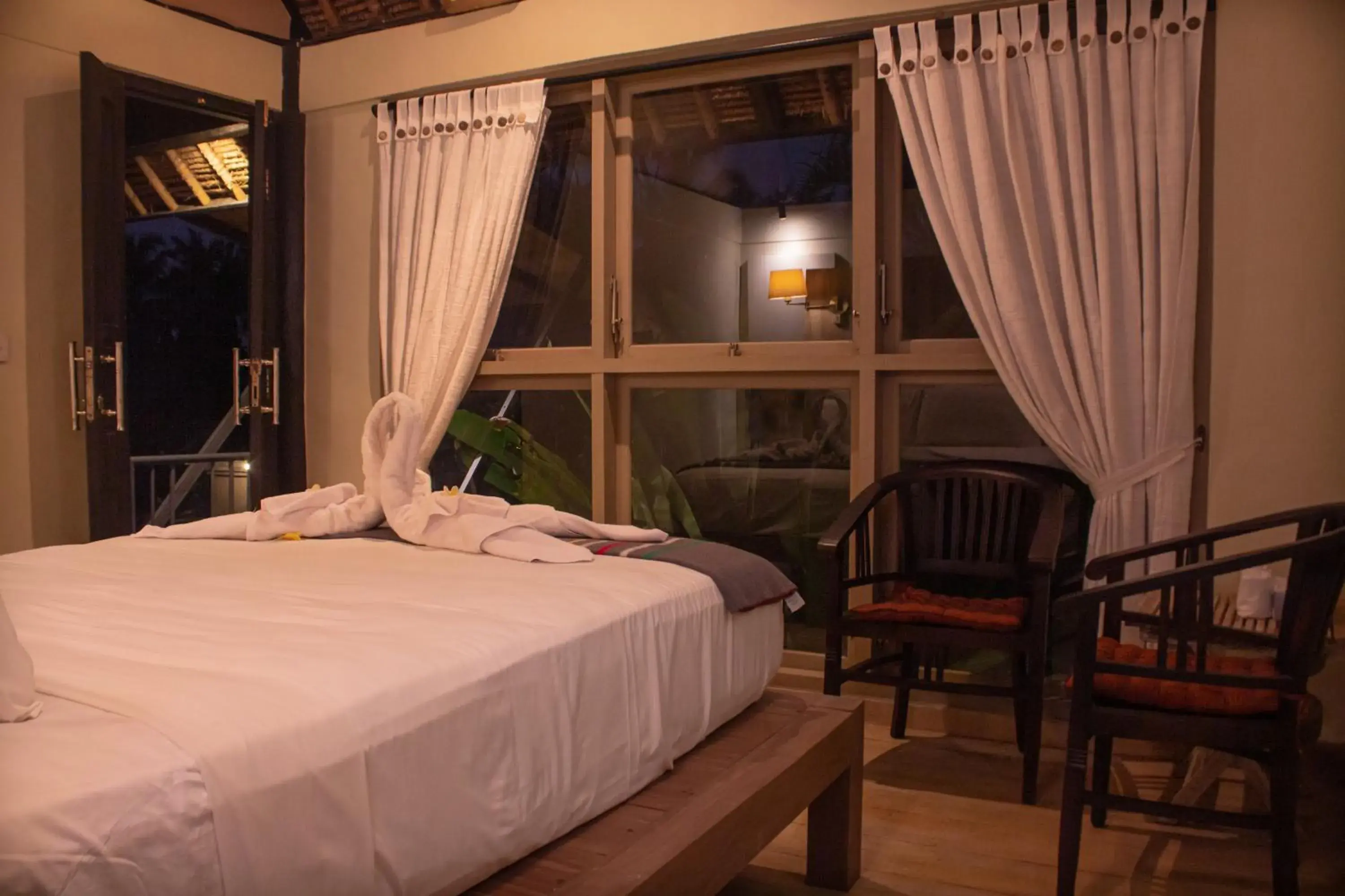 Bed in Puri Darma Agung Villa