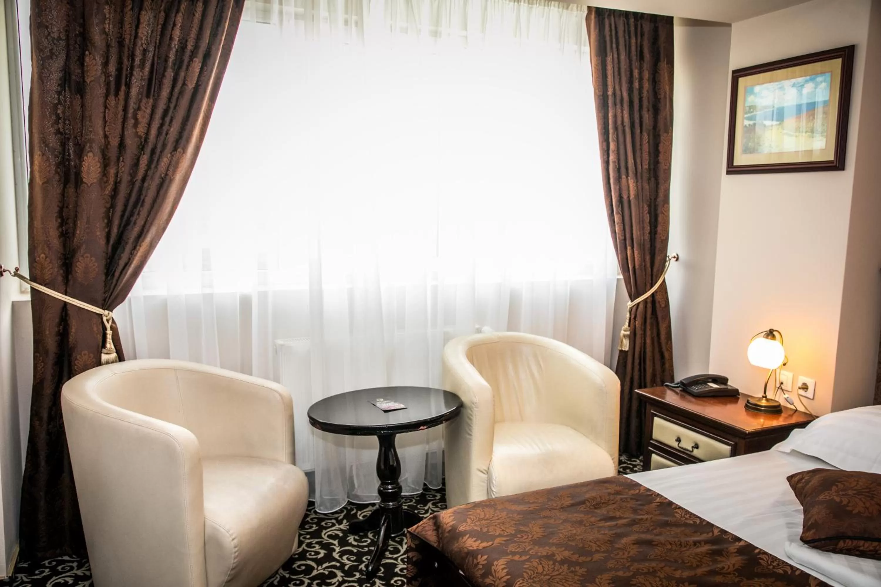 Seating area, Bed in Hotel Megalos