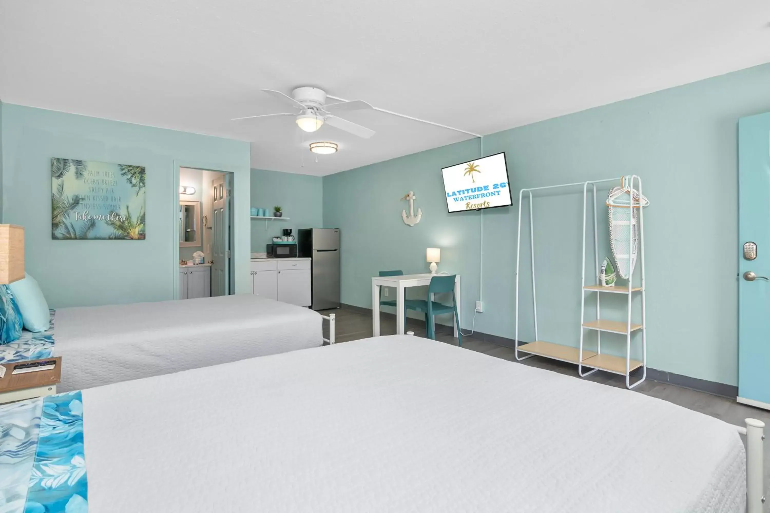 Photo of the whole room, Bed in Latitude 26 Waterfront Boutique Resort - Fort Myers Beach