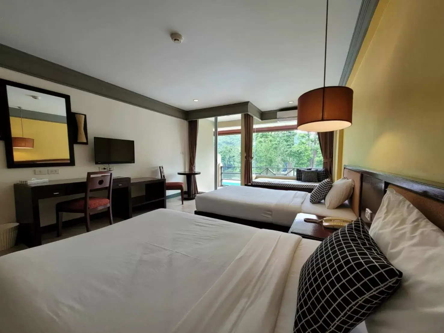 Photo of the whole room, Bed in Aekpailin River Kwai Resort