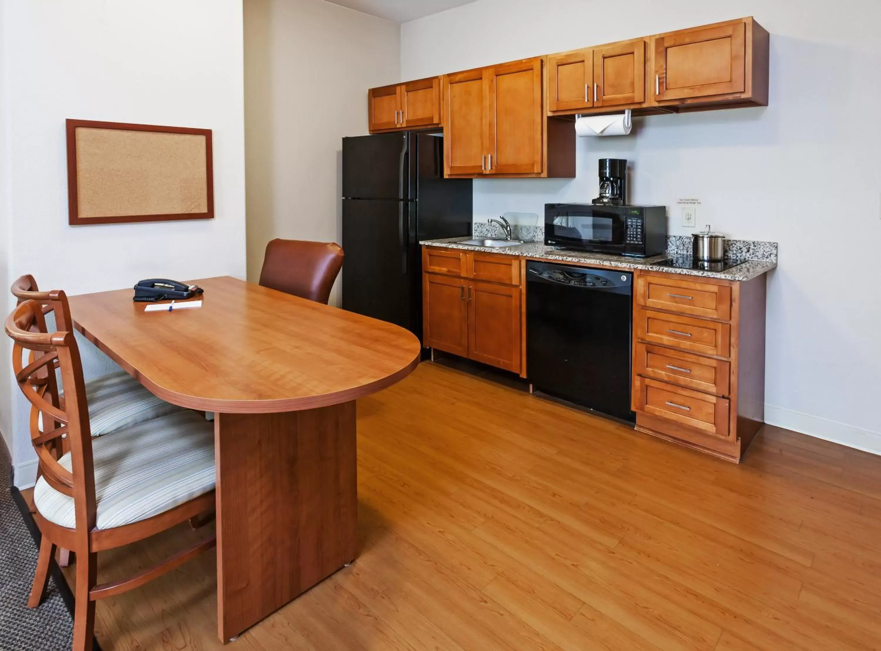 Photo of the whole room, Kitchen/Kitchenette in Candlewood Suites Baytown, an IHG Hotel