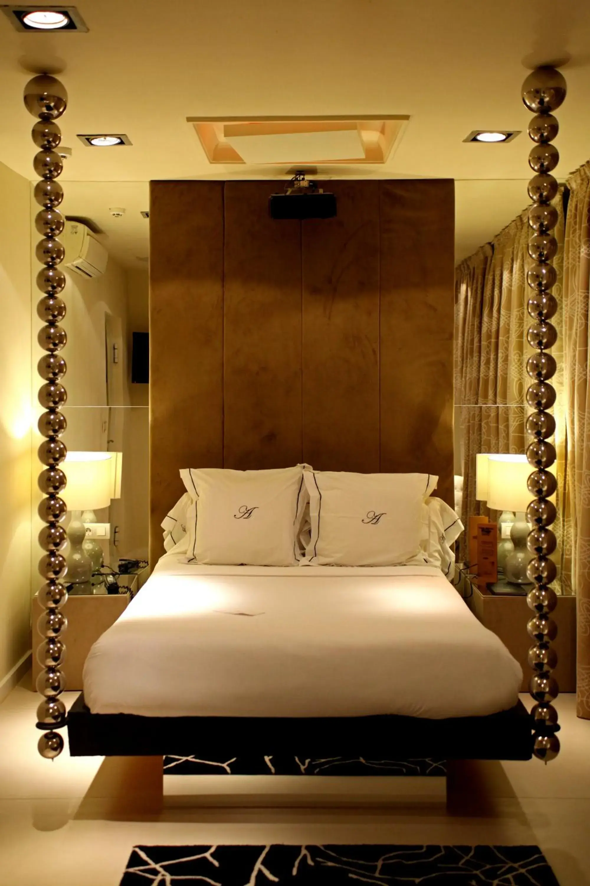 Bed in Abalú Small Luxury & Design Boutique Hotel