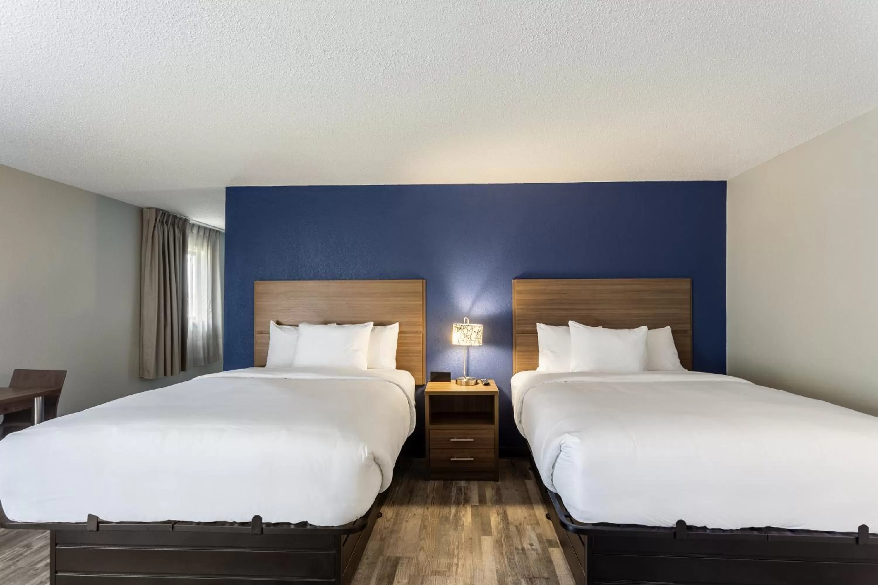 Bed in MainStay Suites Bourbonnais - Kankakee