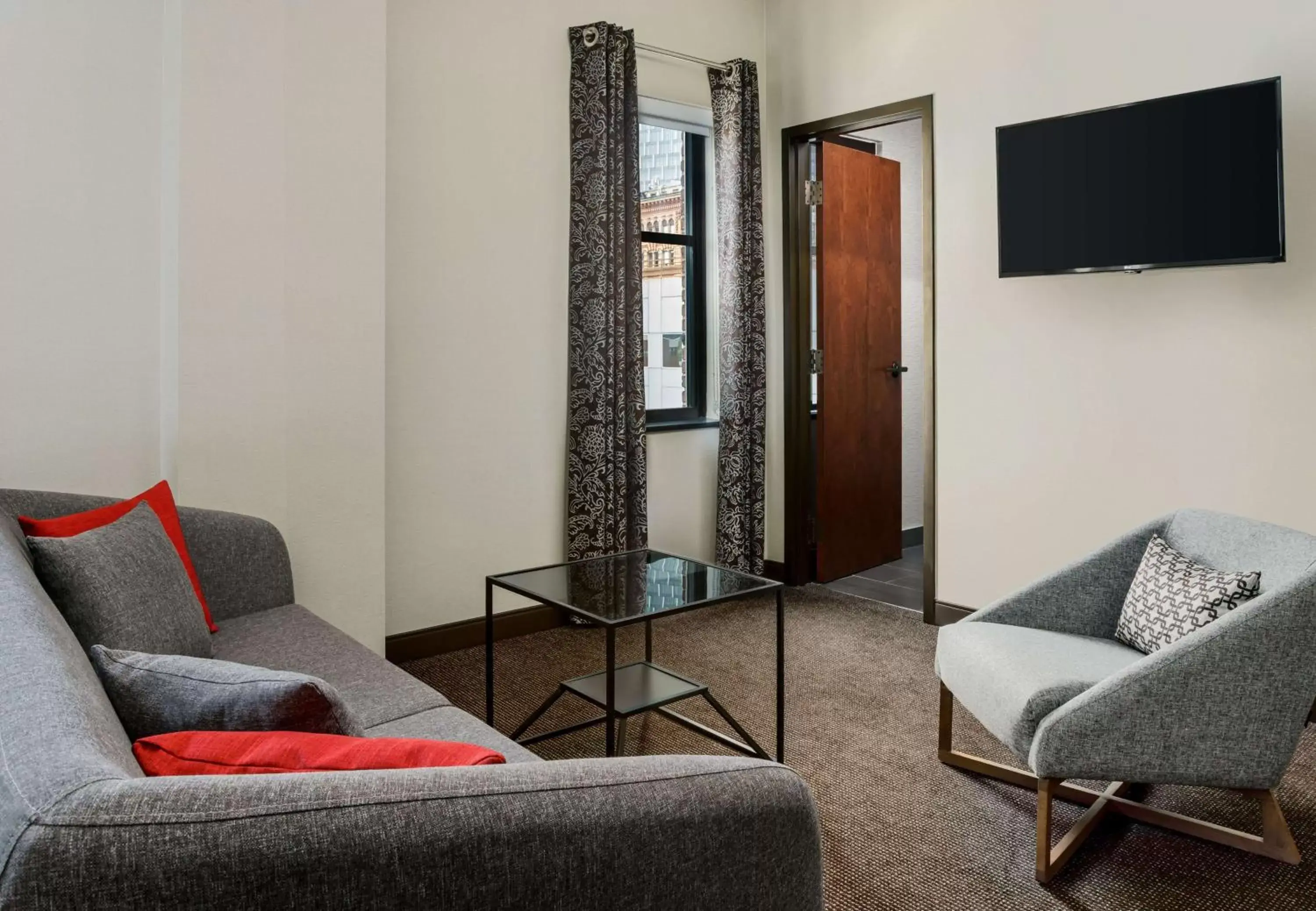 Bedroom, Seating Area in Joinery Hotel Pittsburgh, Curio Collection by Hilton