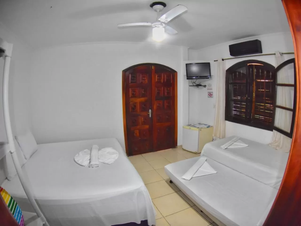 Bed in Pousada Praia do Tombo