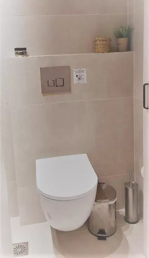 Toilet, Bathroom in Calmare suites