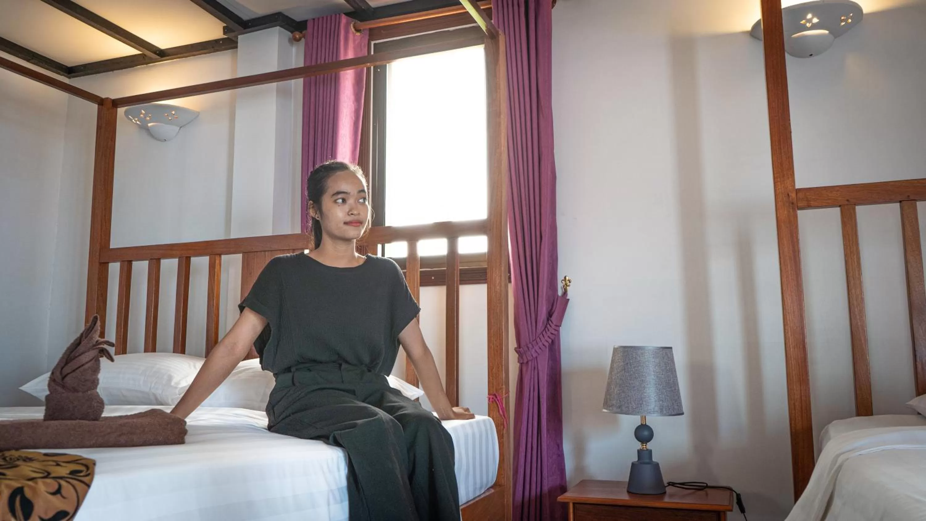 Bed in DEN HOTEL TOTONOU SIEM REAP