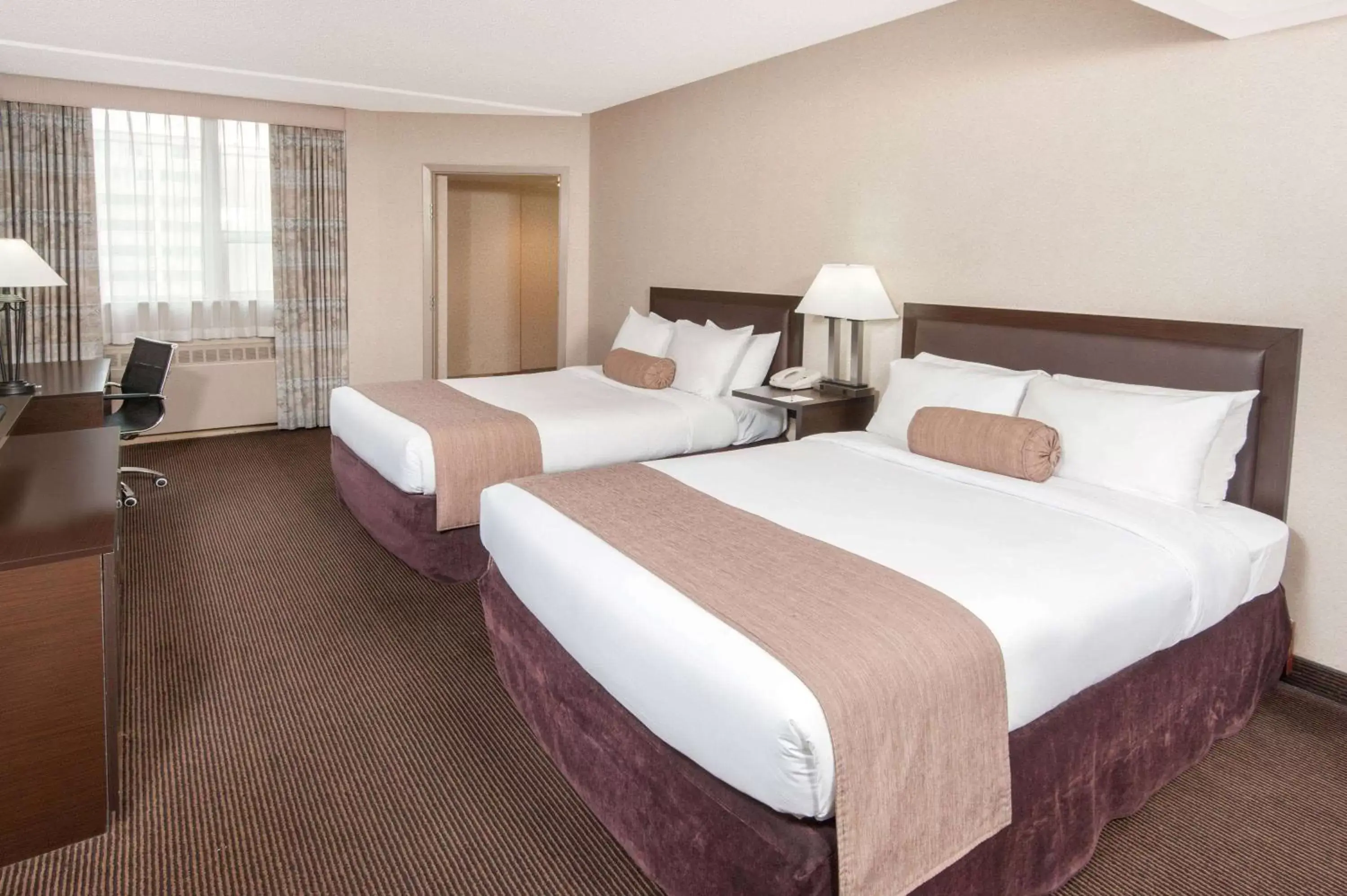 Photo of the whole room, Bed in Ramada Plaza by Wyndham Calgary Downtown