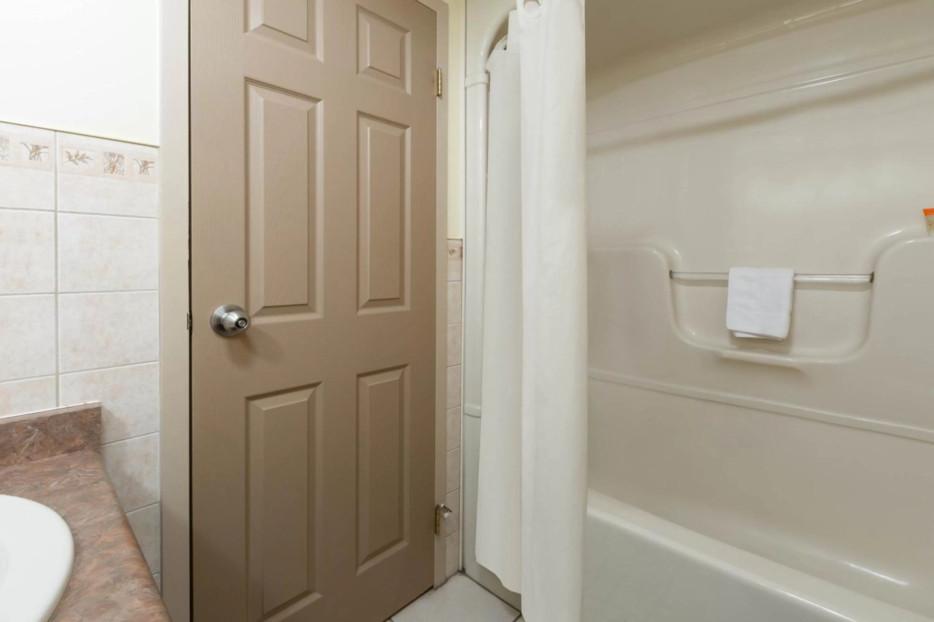 Bathroom in Super 8 by Wyndham Niagara Falls by the Falls