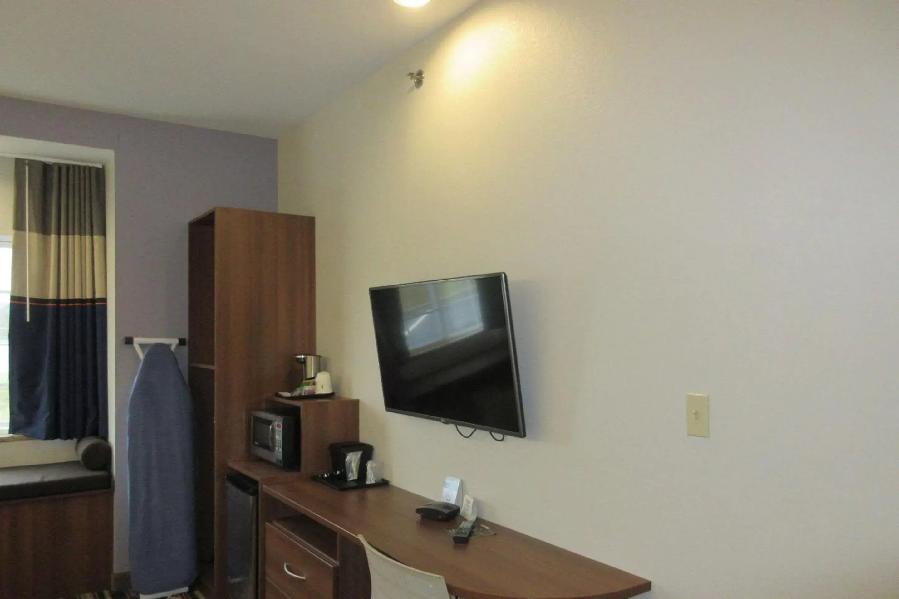 Photo of the whole room, TV/Entertainment Center in Quality Inn & Suites