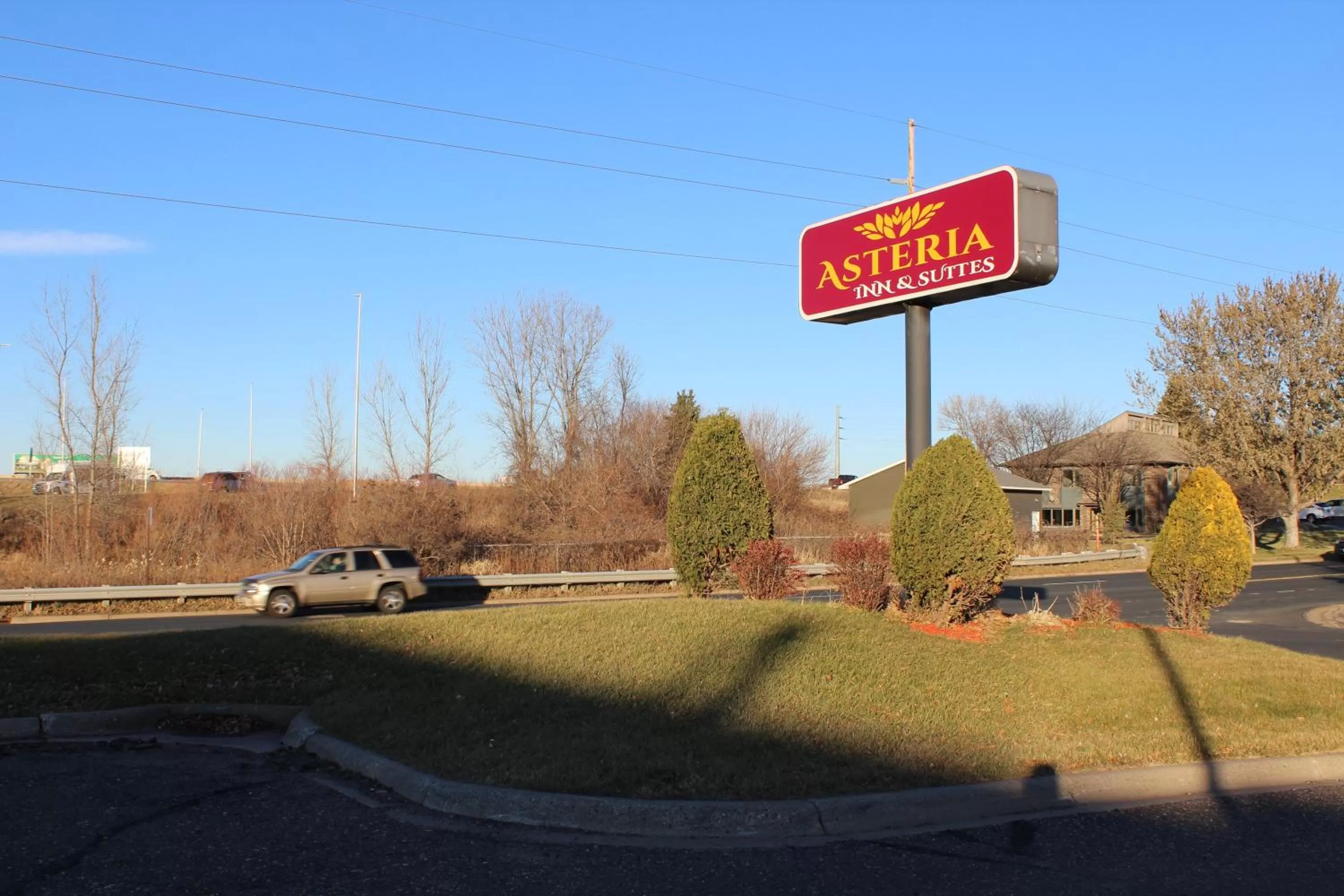 Property logo or sign in Coratel Inn and Suites Maple Grove