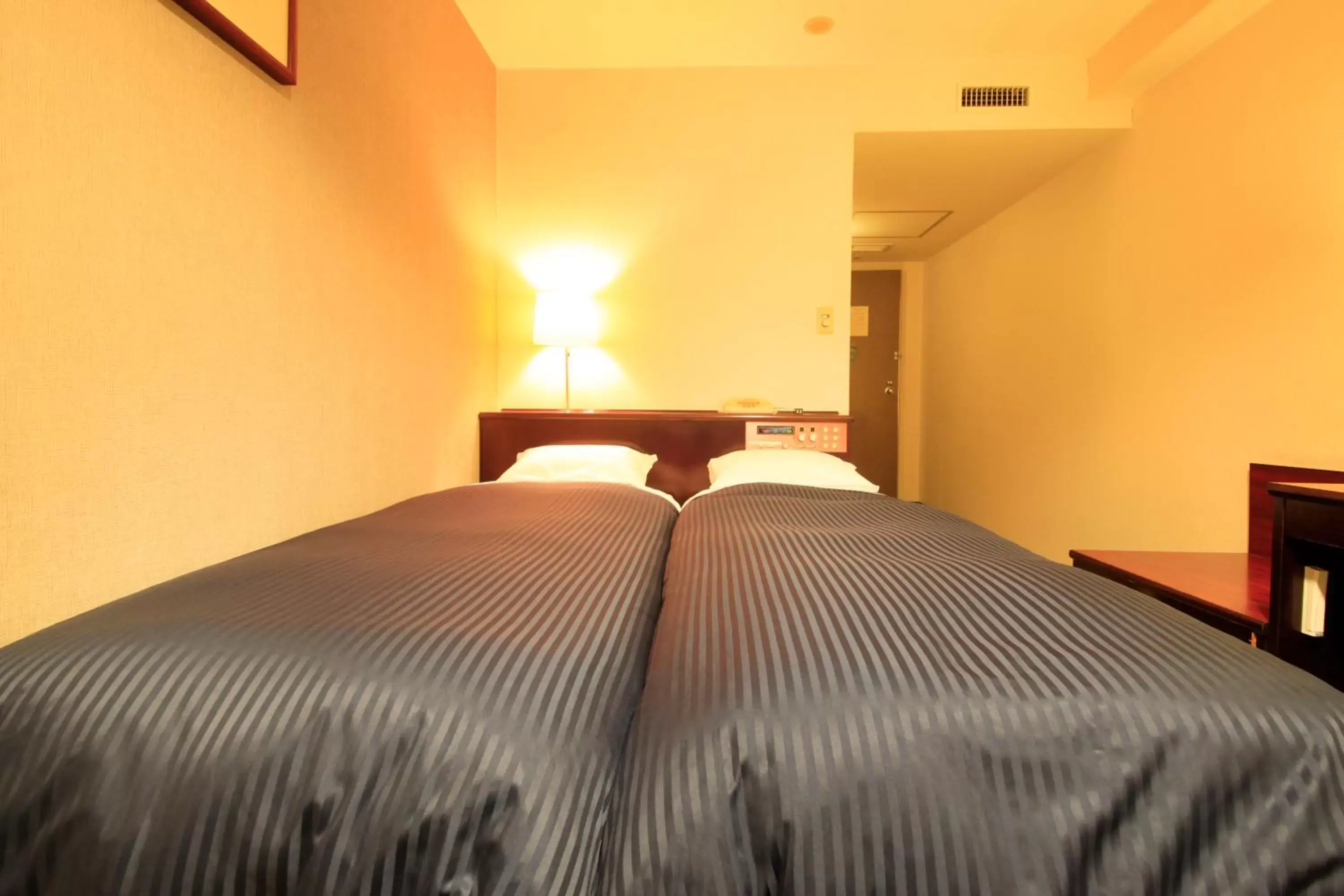 Photo of the whole room, Bed in Quintessa Hotel Ogaki