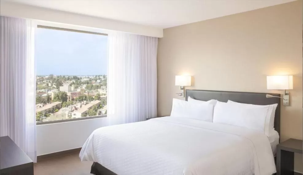 Bed in Fiesta Inn Parque Puebla