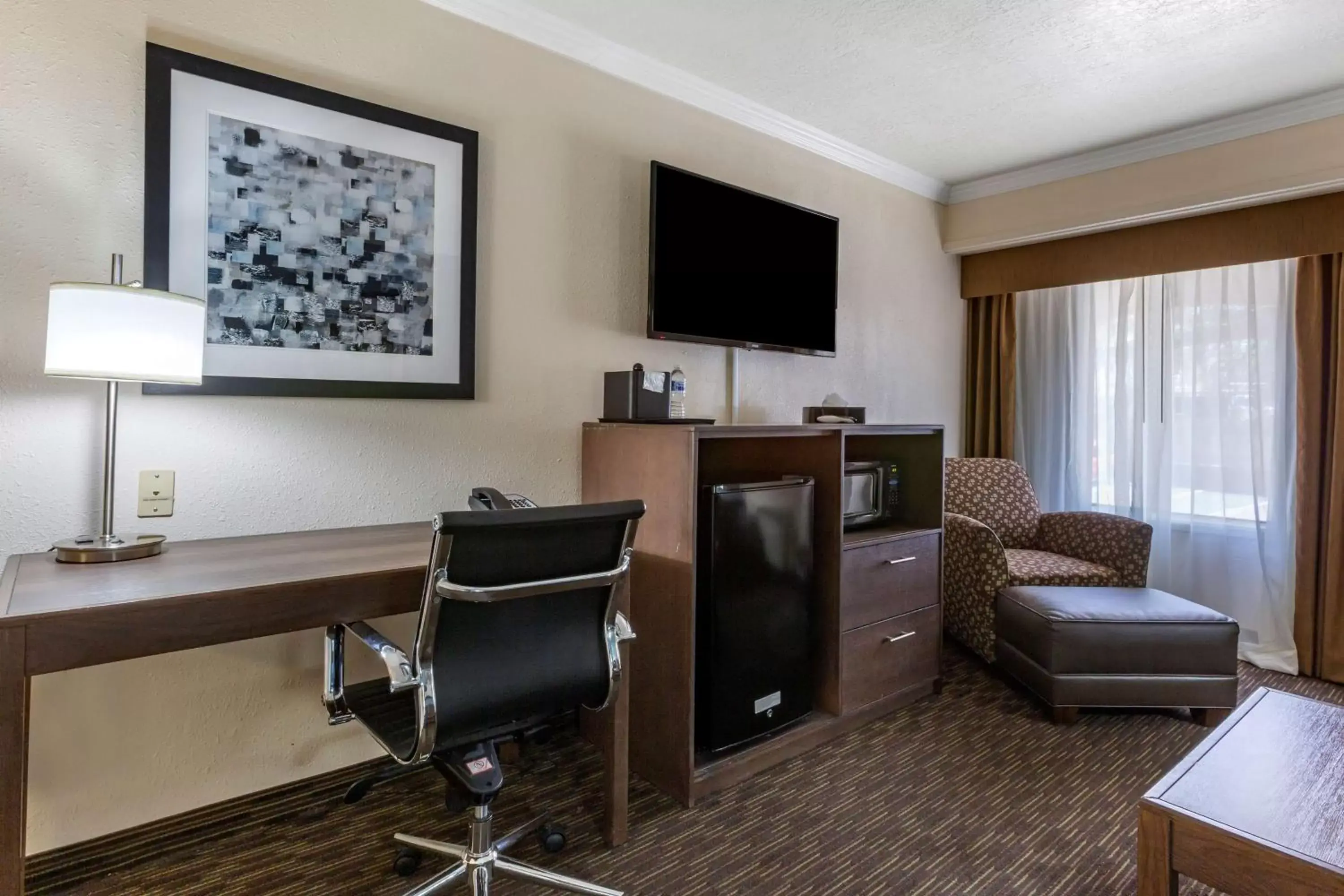 Photo of the whole room, TV/Entertainment Center in Best Western Airport Albuquerque InnSuites Hotel & Suites