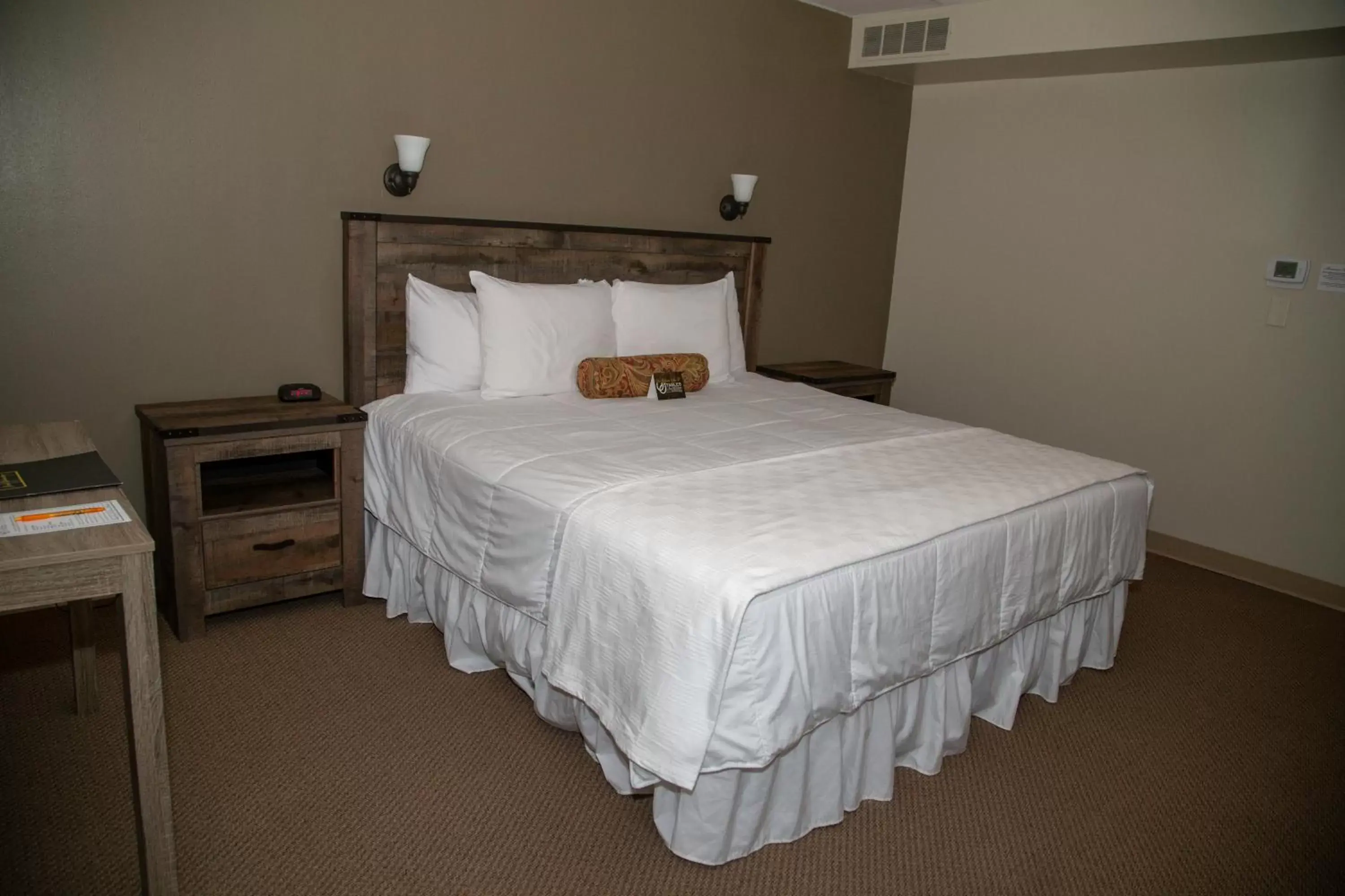 Bed in The Stables Inn & Suites