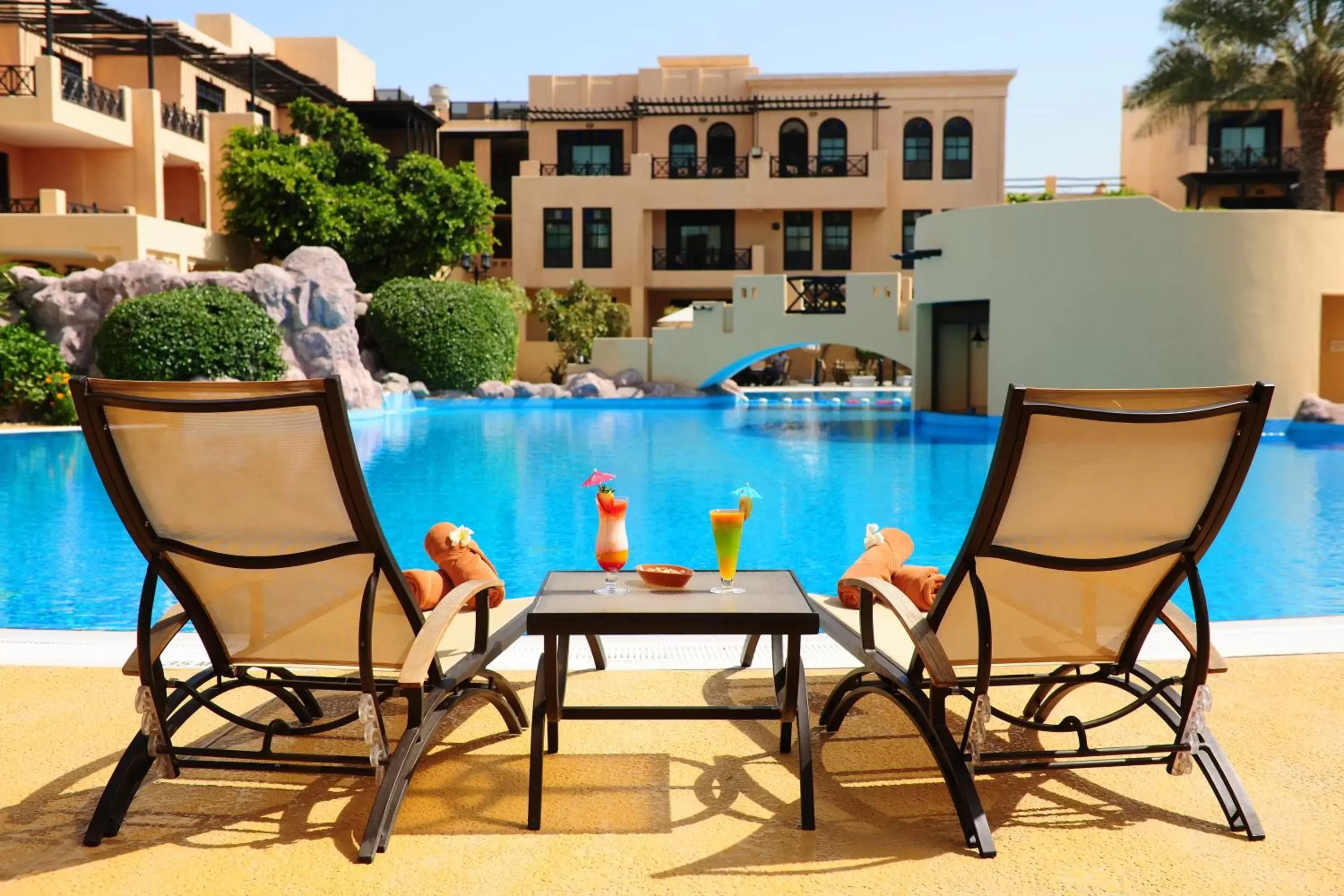 Patio, Swimming Pool in Novotel Bahrain Al Dana Resort