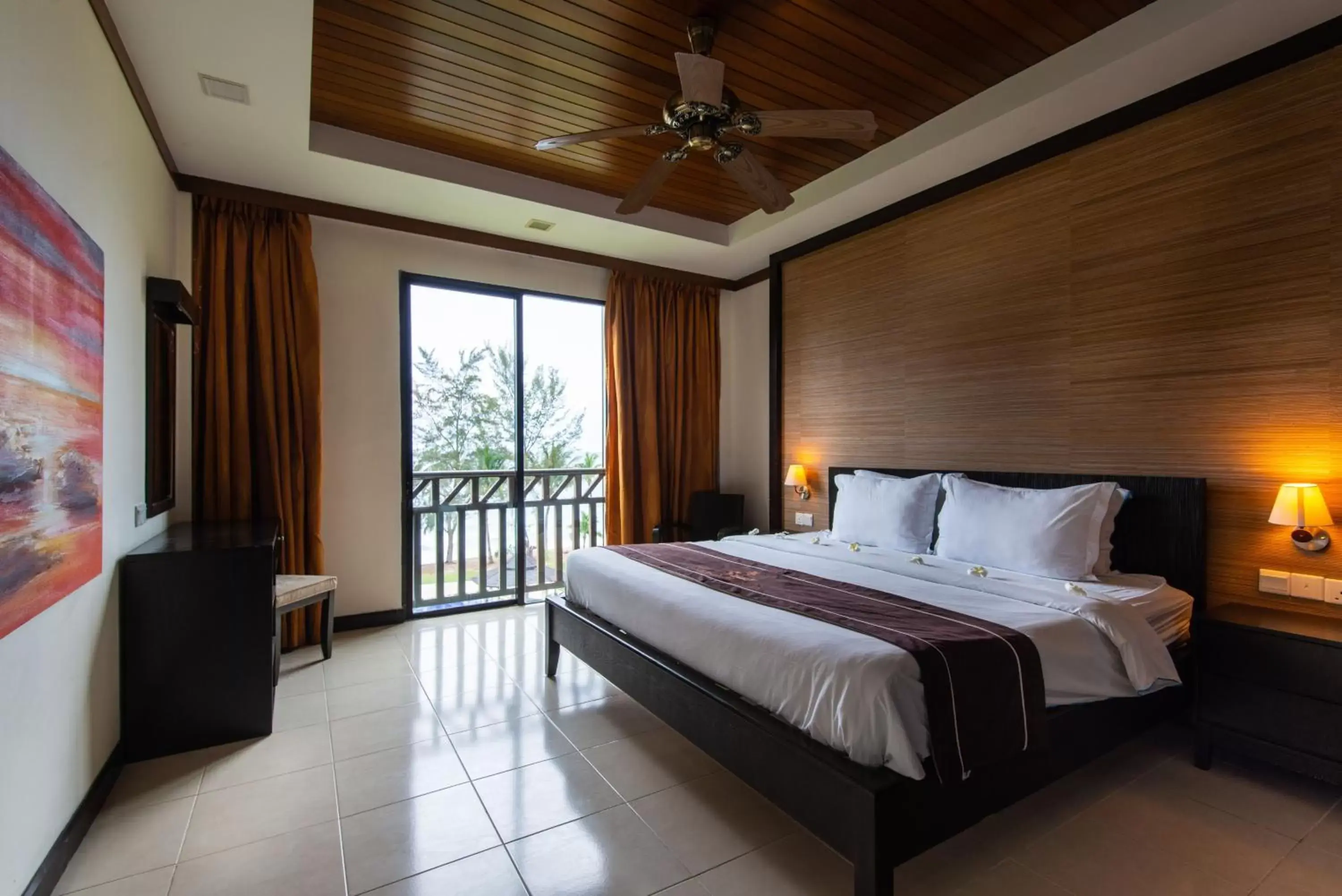 Bed in Sabah Beach Villas & Suites