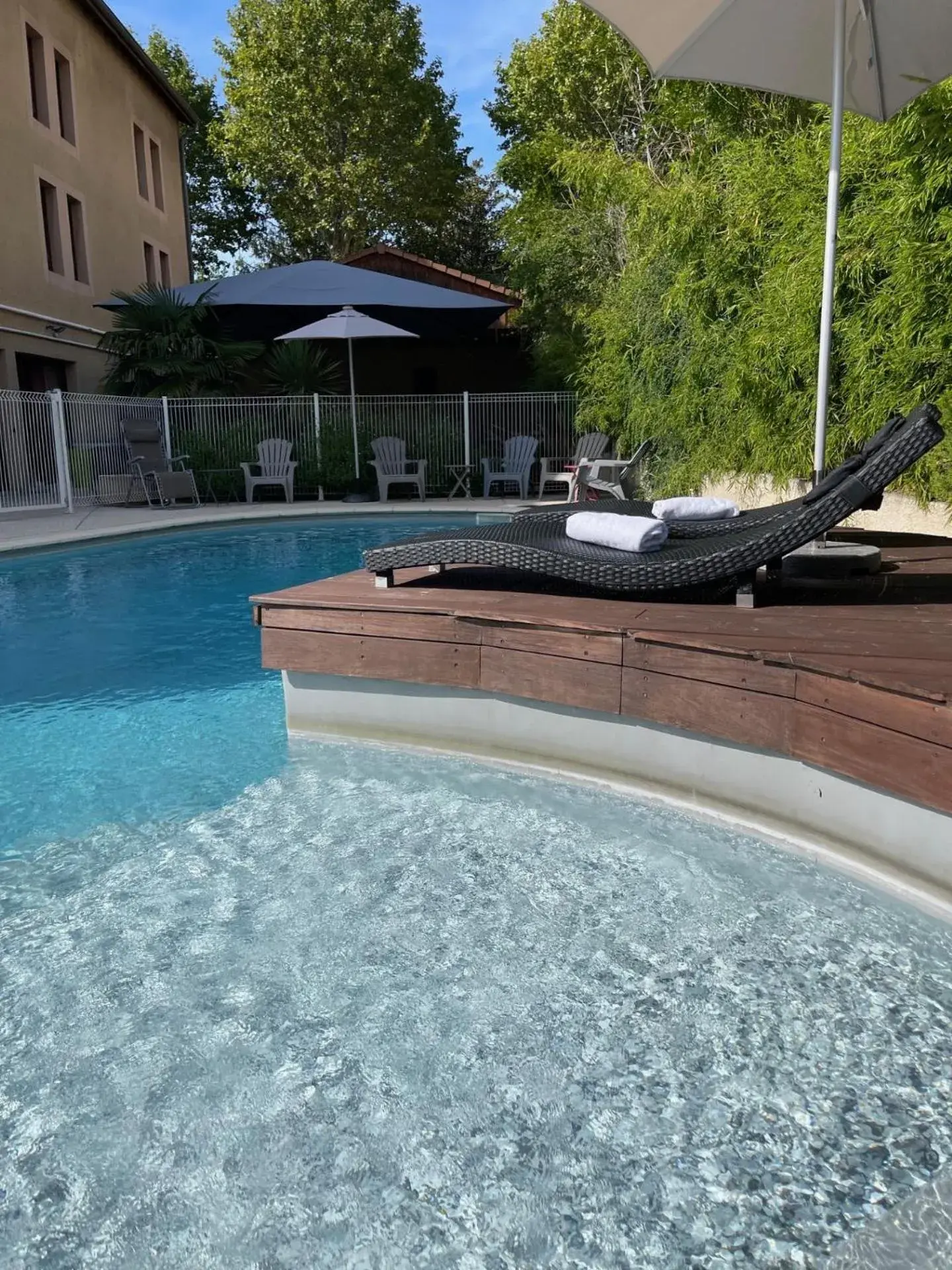 Swimming Pool in Hotel The Originals Romans-sur-Isère Le Clos des Tanneurs