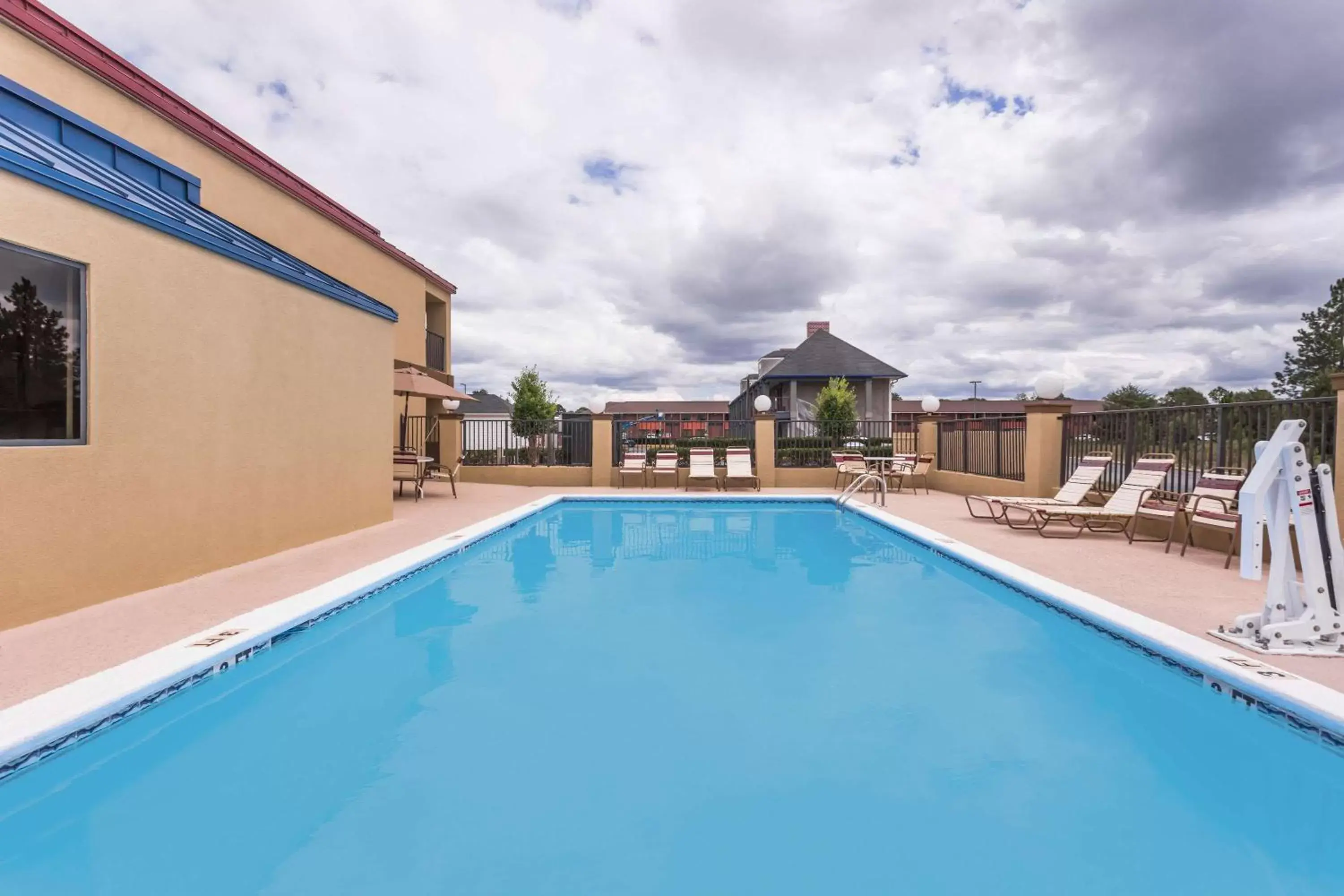 On site, Swimming Pool in Days Inn & Suites by Wyndham Warner Robins Near Robins AFB