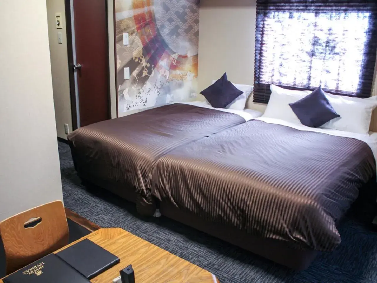 Photo of the whole room, Bed in HOTEL LiVEMAX Kyoto Ekimae