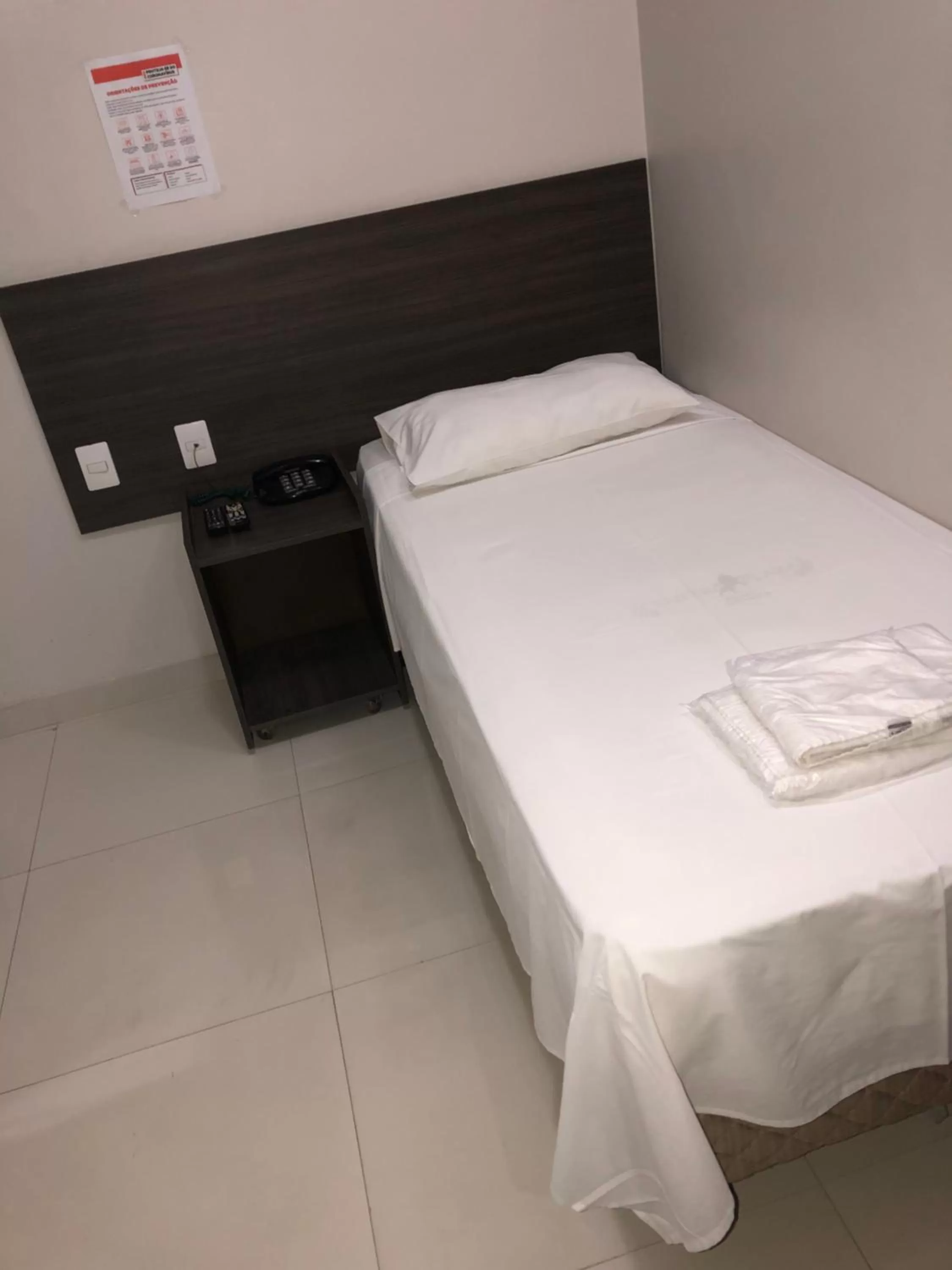 Bed in Center Plaza Hotel