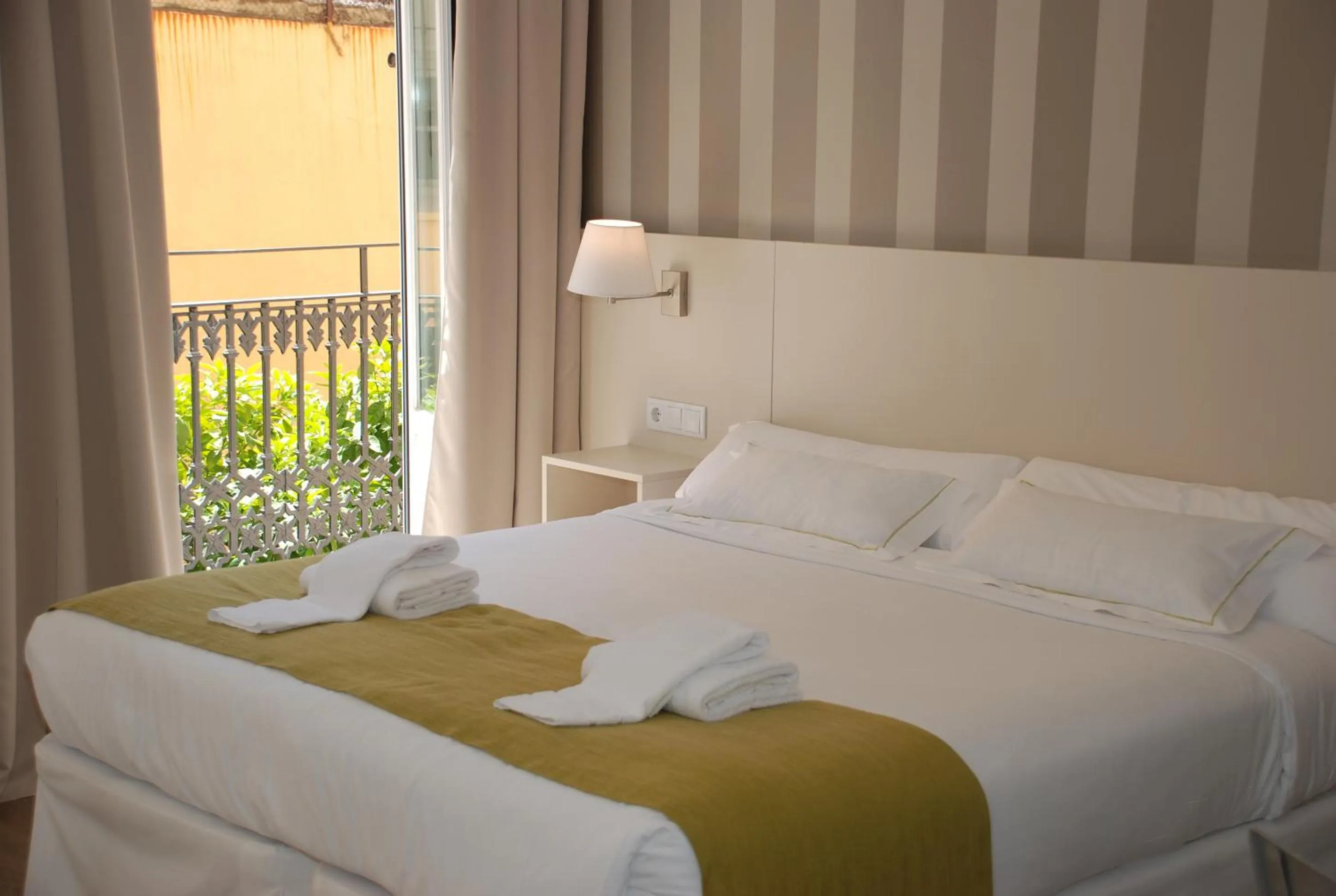 Bed in Hotel San Lorenzo Boutique Plaza