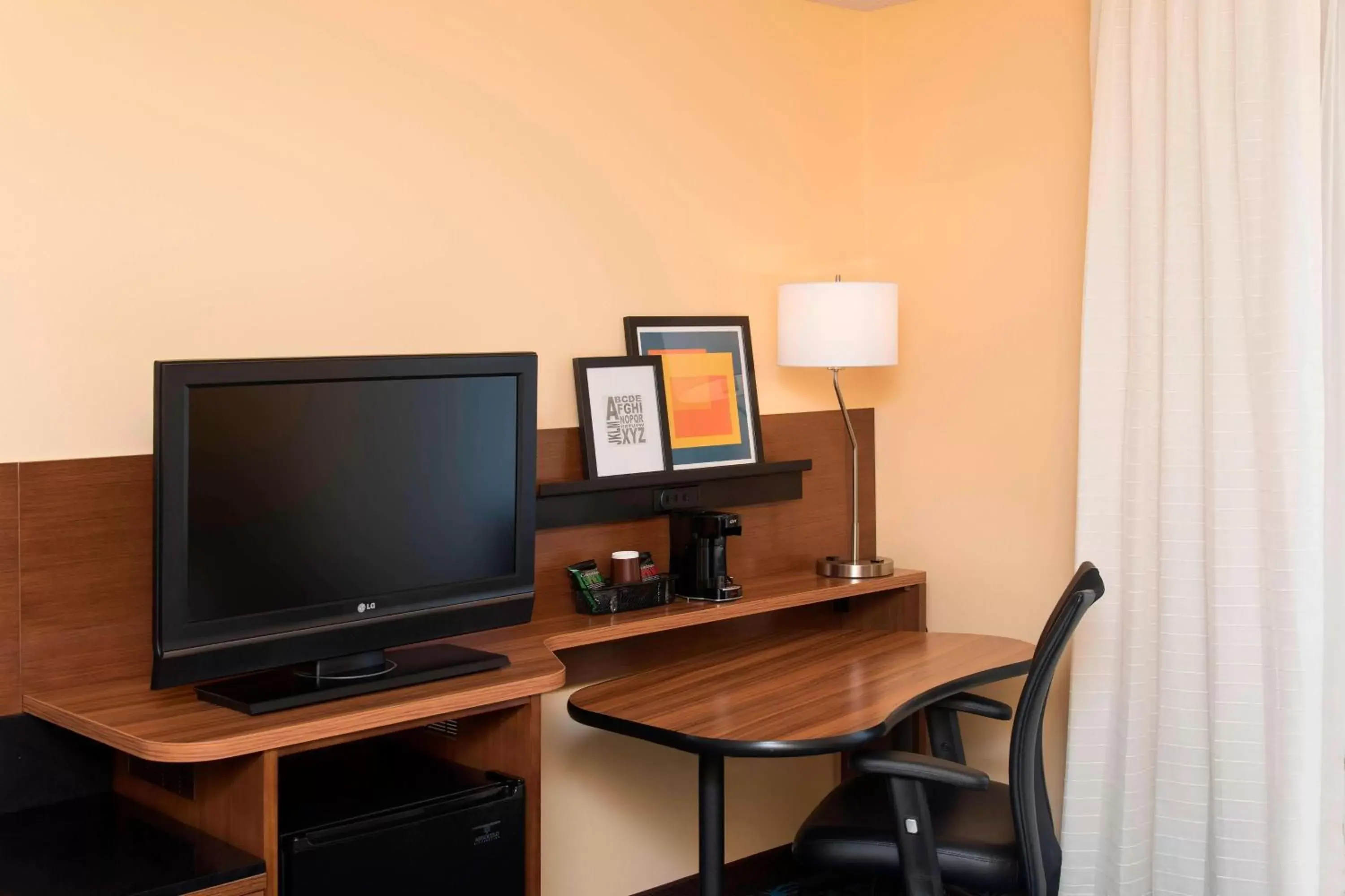 Photo of the whole room, TV/Entertainment Center in Fairfield Inn and Suites by Marriott Chicago St. Charles