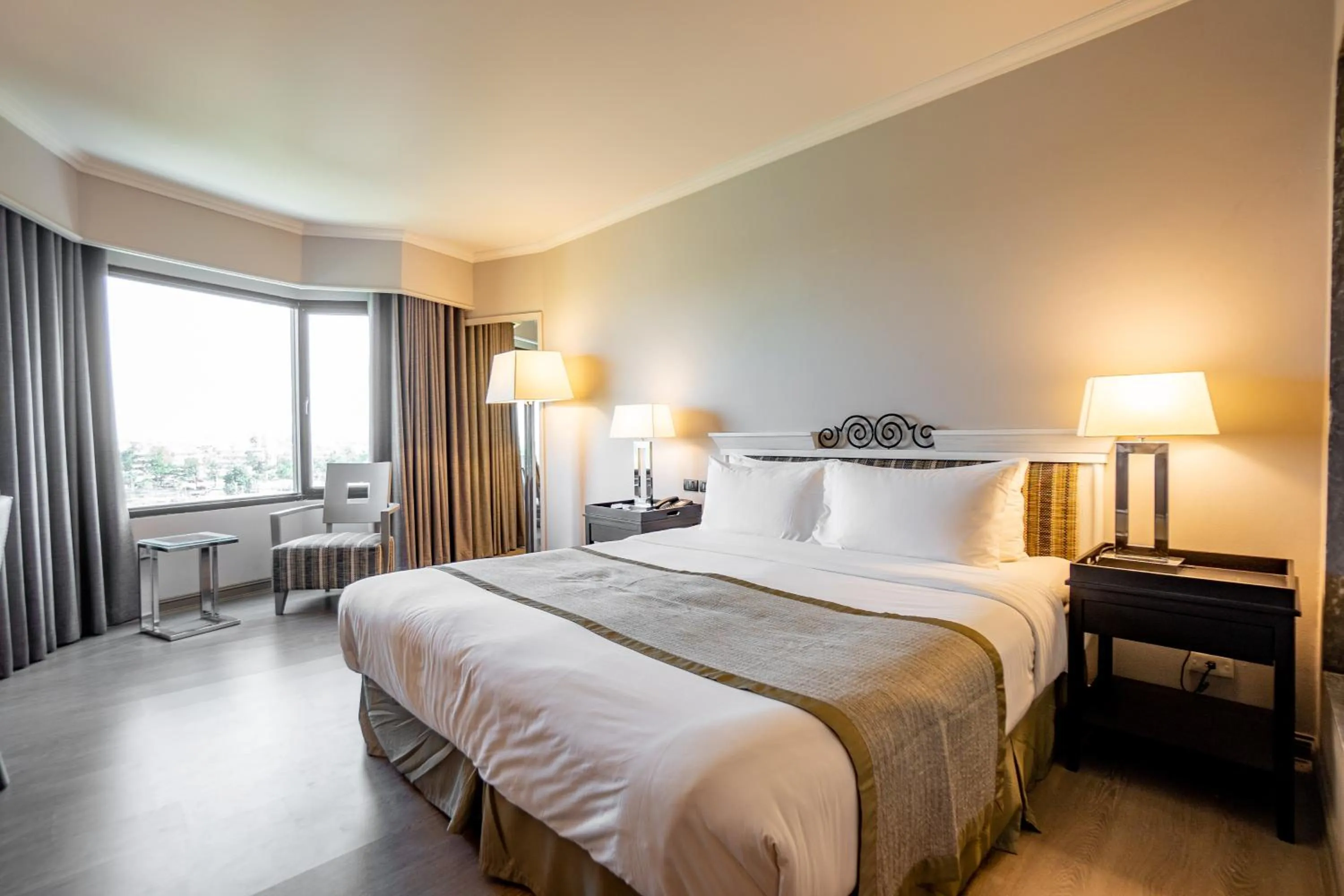 Bed in The Grand Riverside Hotel