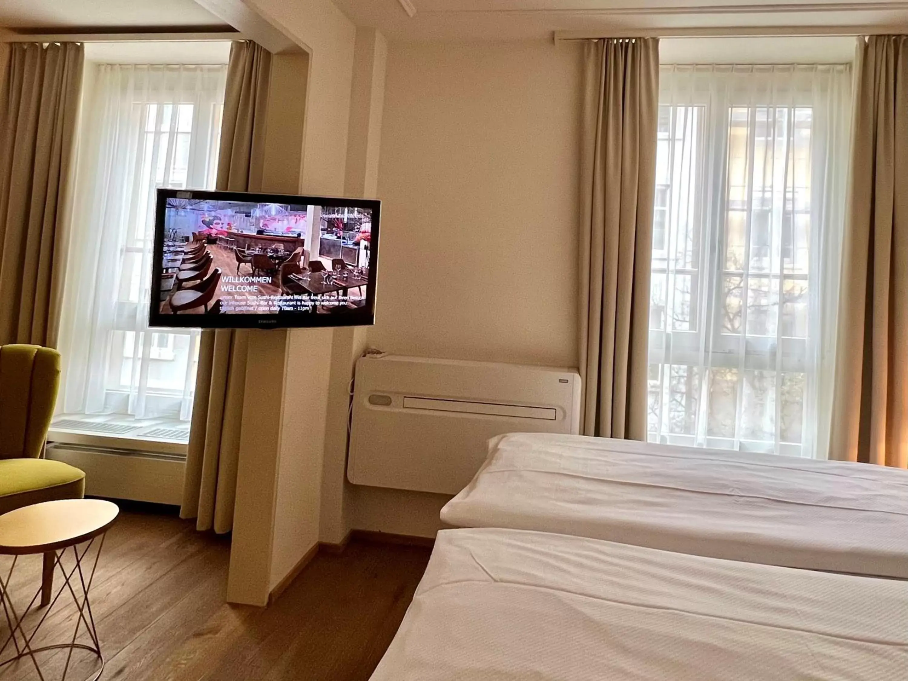 air conditioner, TV/Entertainment Center in Hotel Platzhirsch