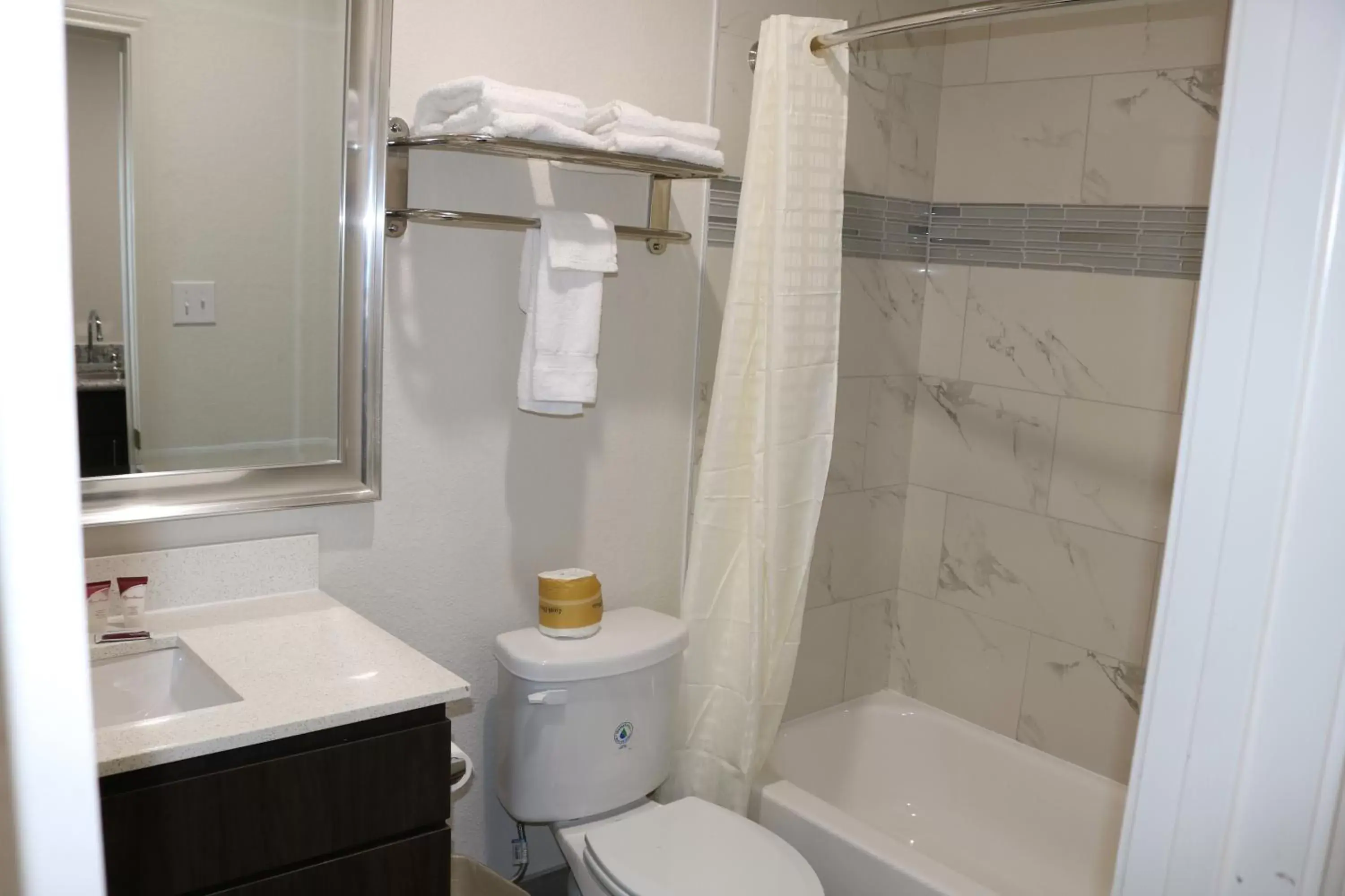 Bathroom in Scottish Inn & Suites - IAH Airport
