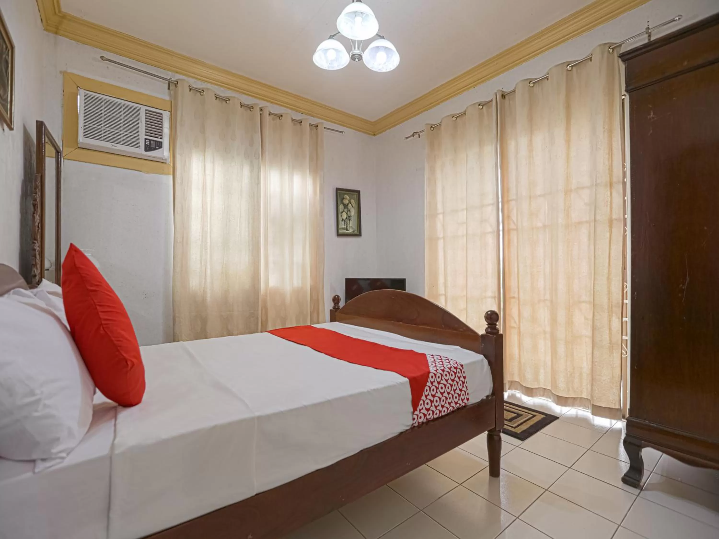 Bedroom in OYO 784 Laura's Garden Resort