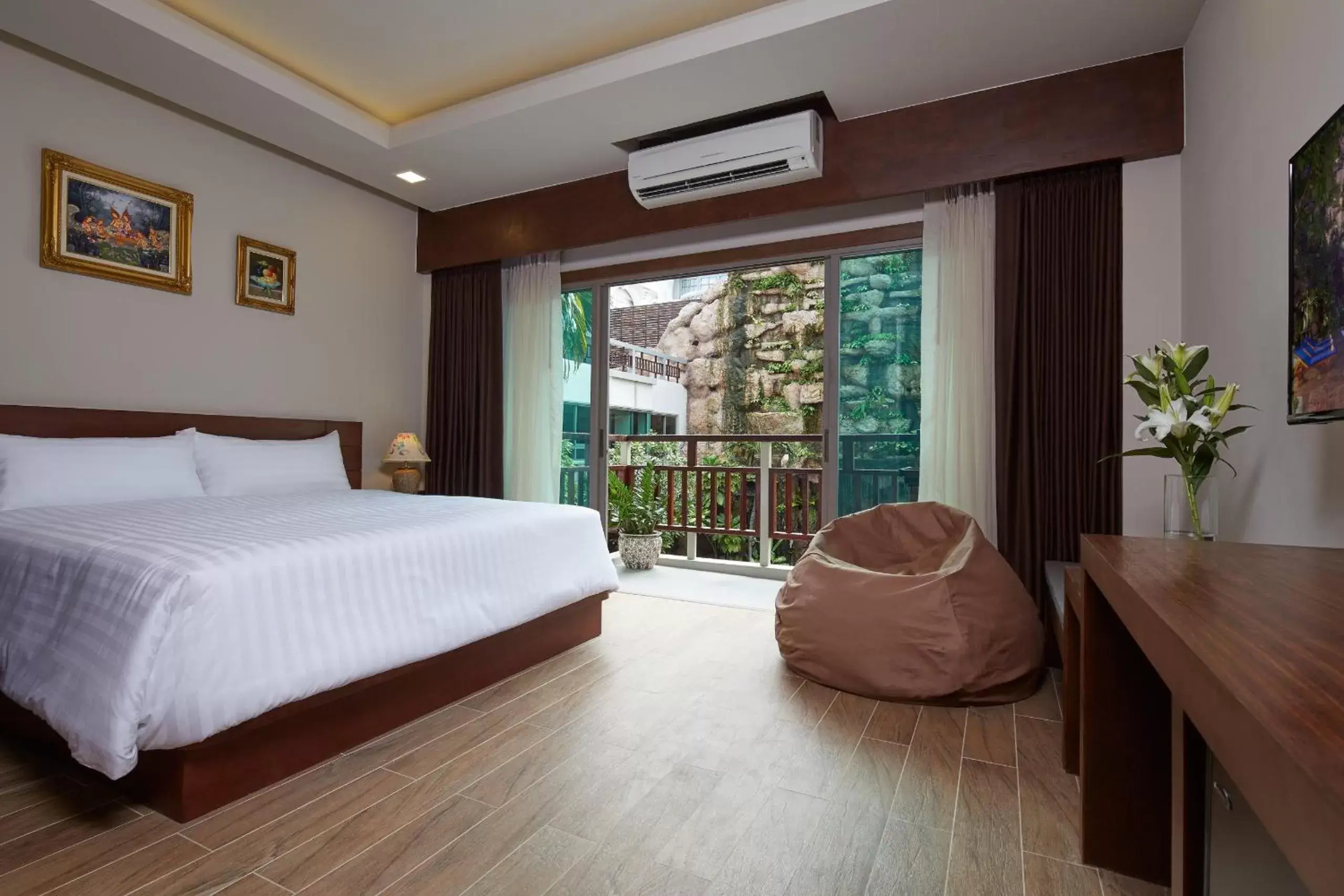 Bed in The Agate Pattaya Boutique Resort