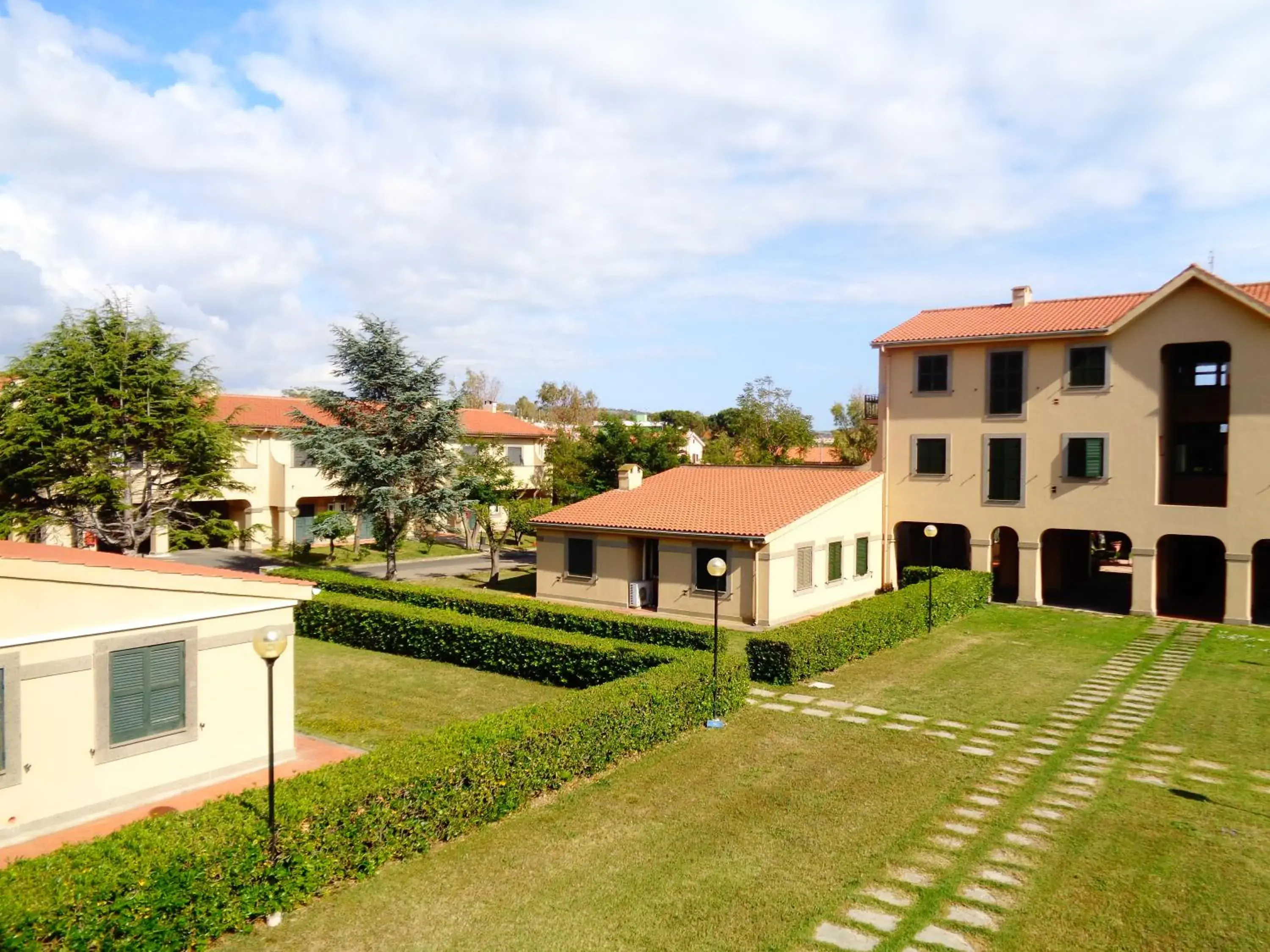 Garden view, Property Building in Hotel Baia Del Sole