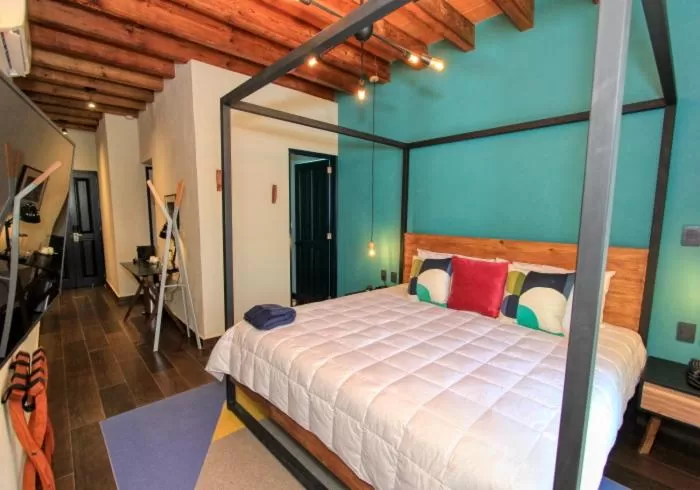 Bed in Antigua Trece Hotel Fusión